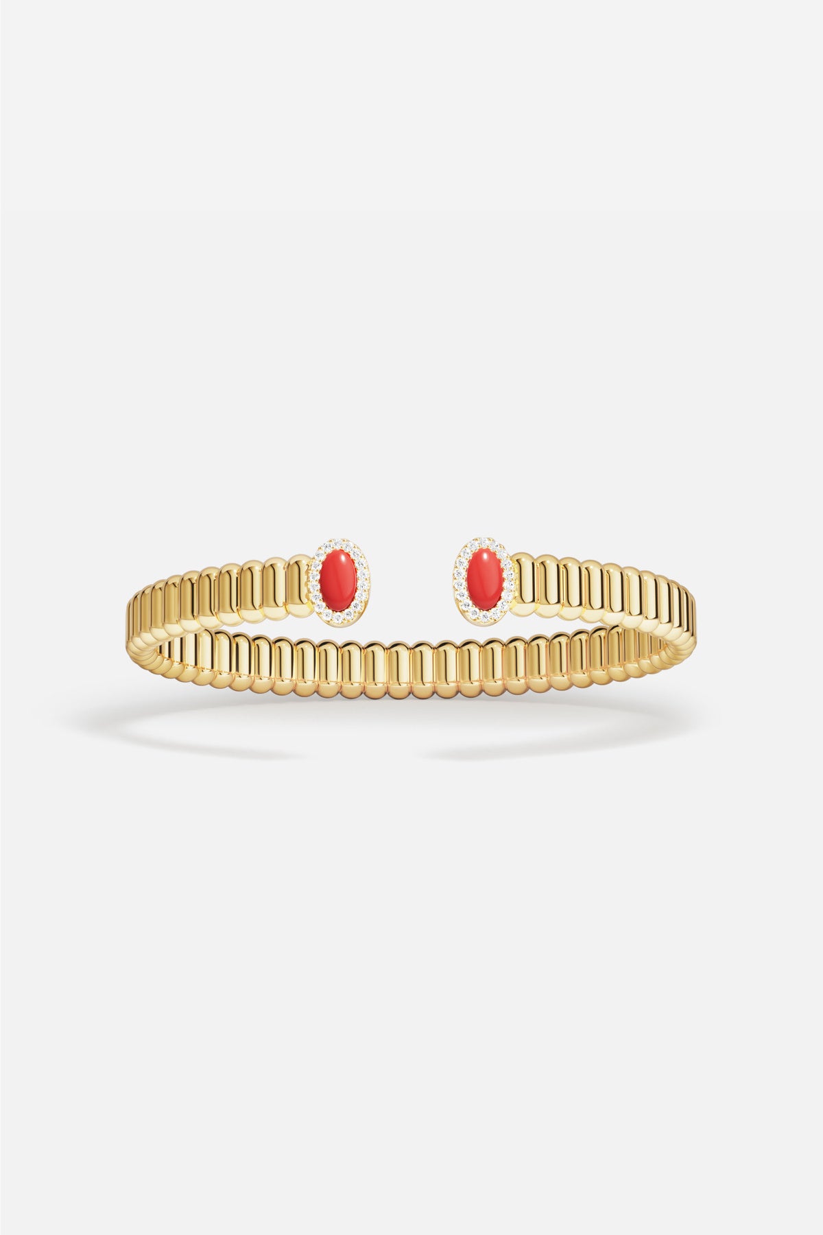 APM Bangle in golden color, ribbed elegance meeting bold red accents.