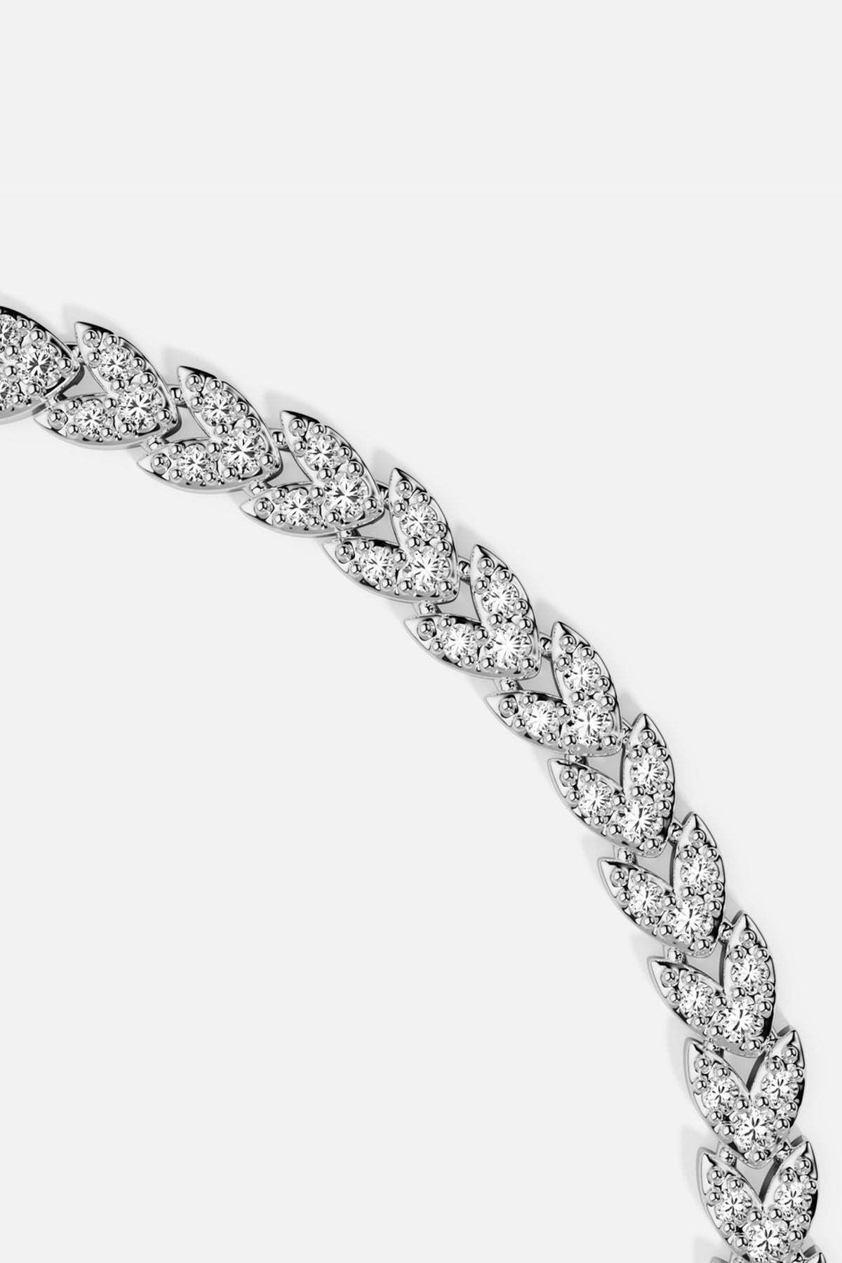 APM Monaco bracelet in rhodium finish, shimmering leaves flowing with quiet elegance.
