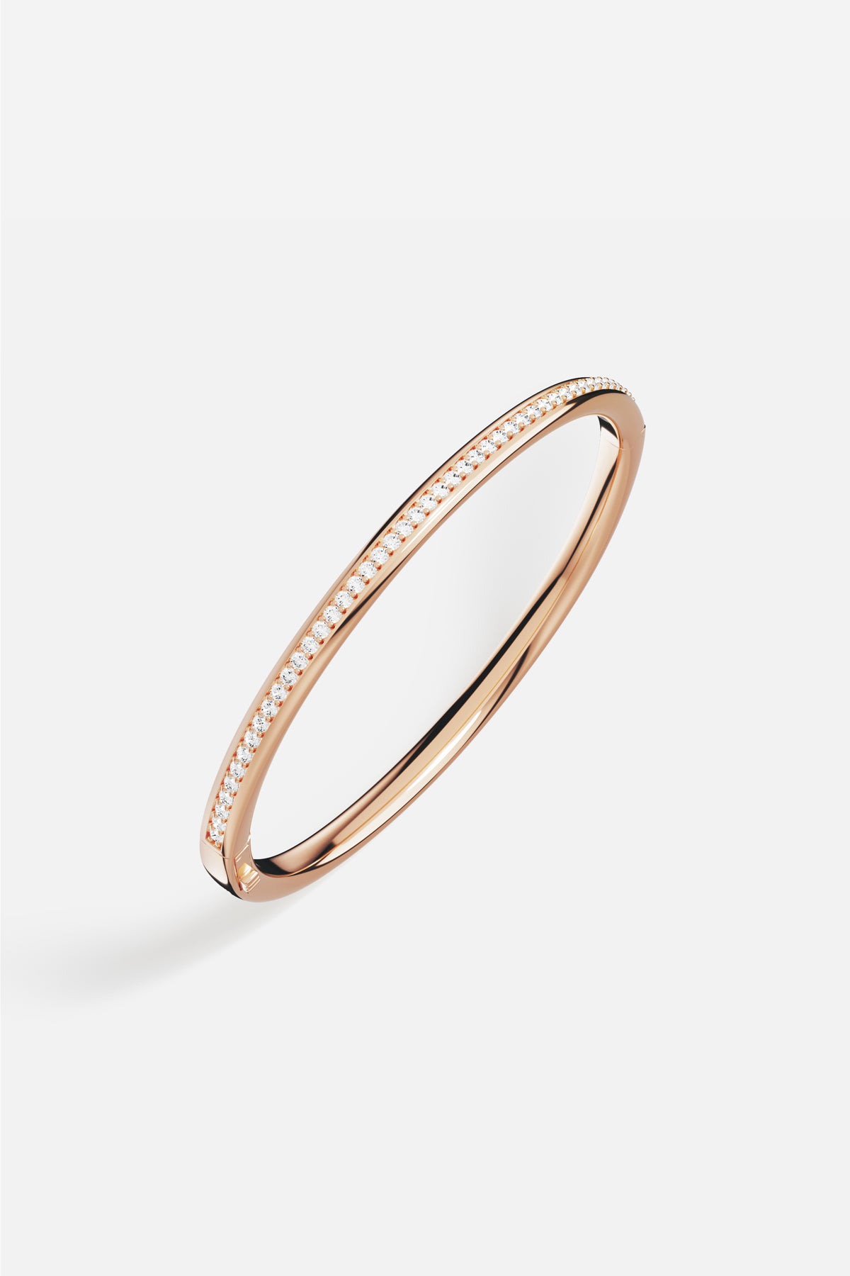 APM Bangle in rose color, a sleek line of quiet brilliance.