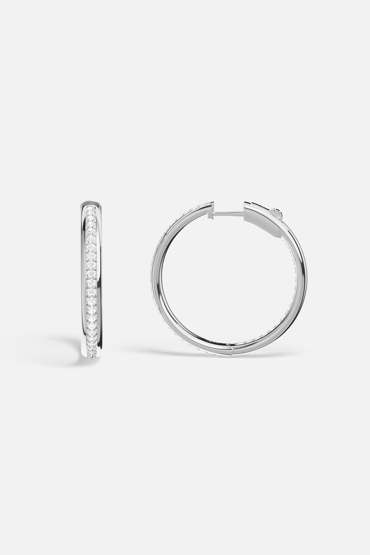 APM Hoop Earrings in rhodium finish, a luminous circle of effortless elegance.
