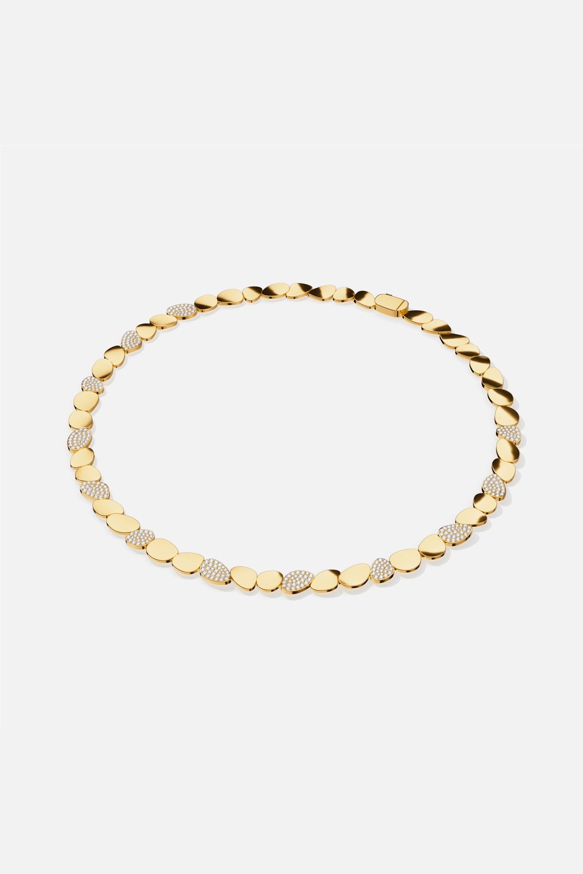 APM Necklace in gold color, a fluid cascade of pebbles shimmering with quiet confidence.
