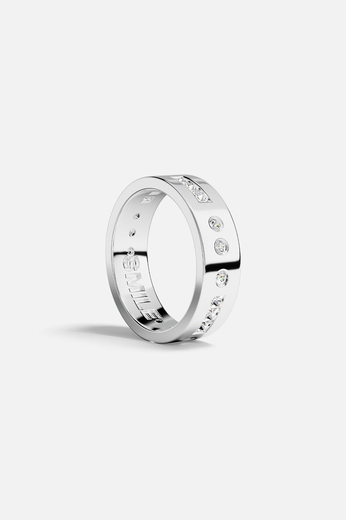 Rings APM Monaco: silver-tone Morse-code ring with scattered stones and SMILE engraving on the inner band.