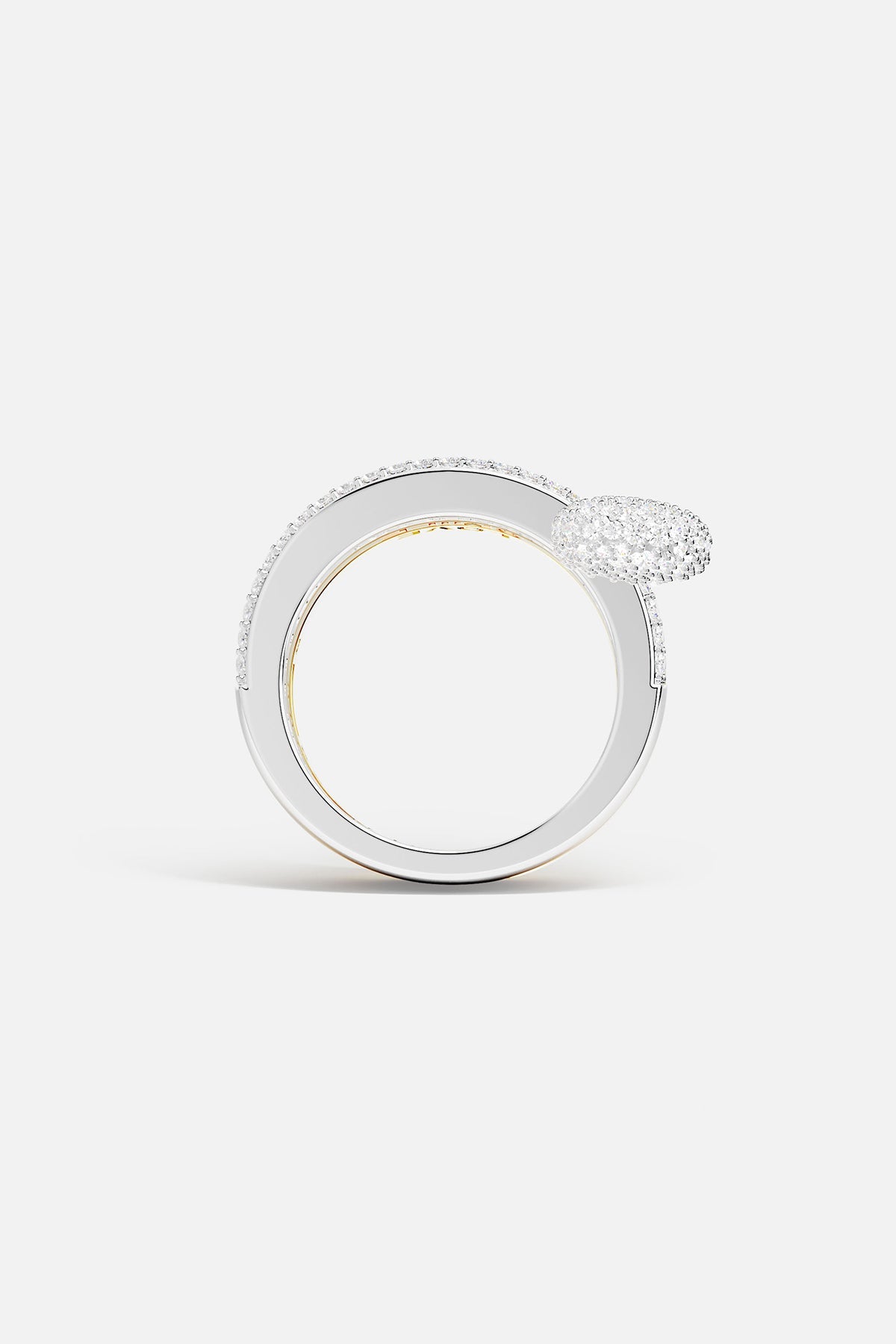 Rings APM Monaco fashion jewelry: a white, triple-hoop safety-pin ring with pavé cubic zirconia, paired with two additional cubic zirconia rings.