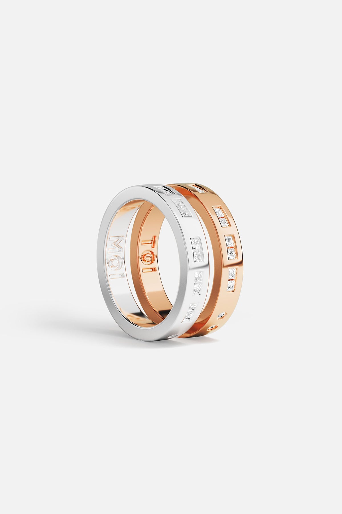 Rings APM Monaco: three stacked rings in white metal with MOI, rose gold with TOI, and yellow gold with white cubic zirconia.