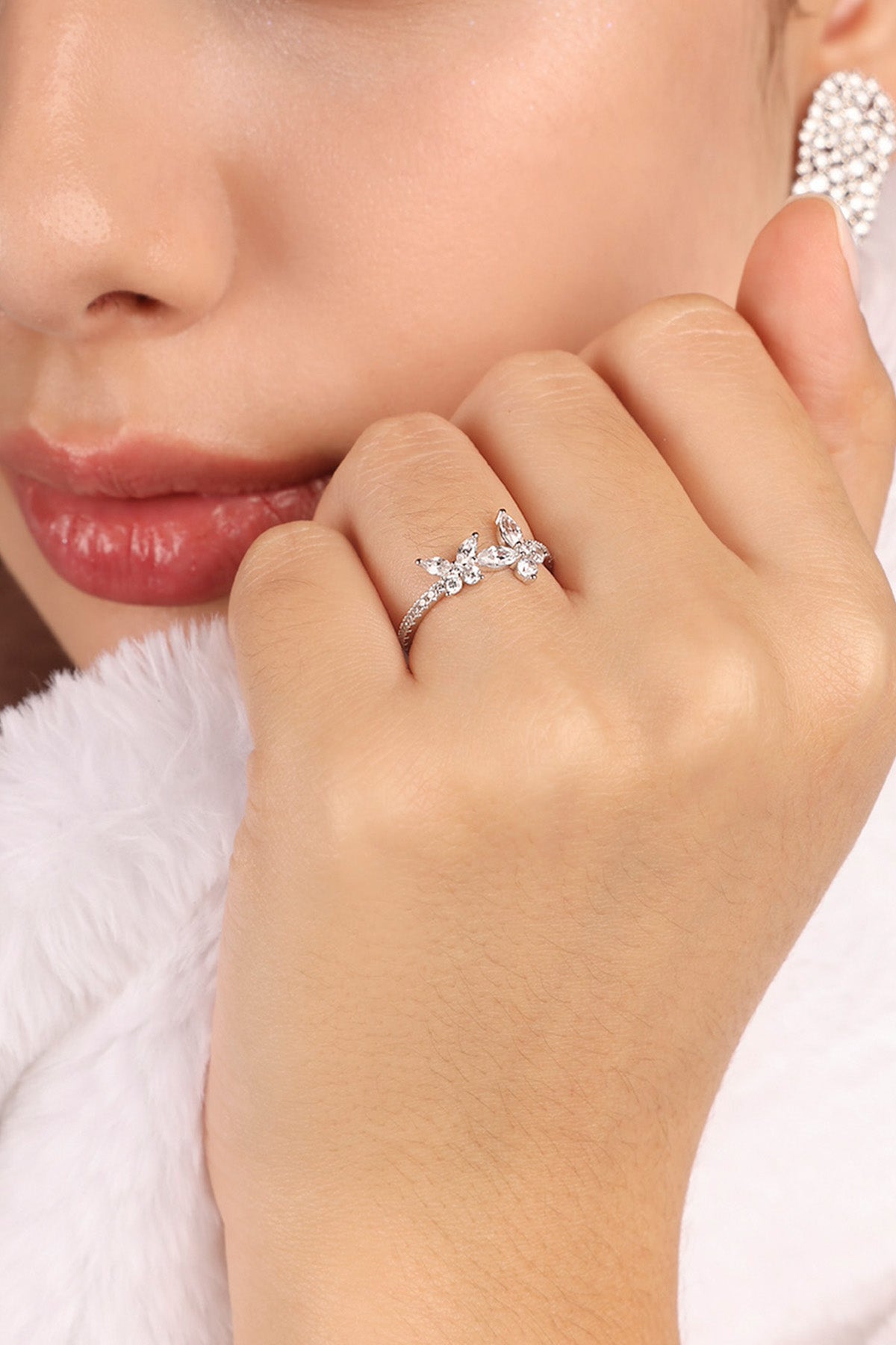model wearing butterflies ring in white silver