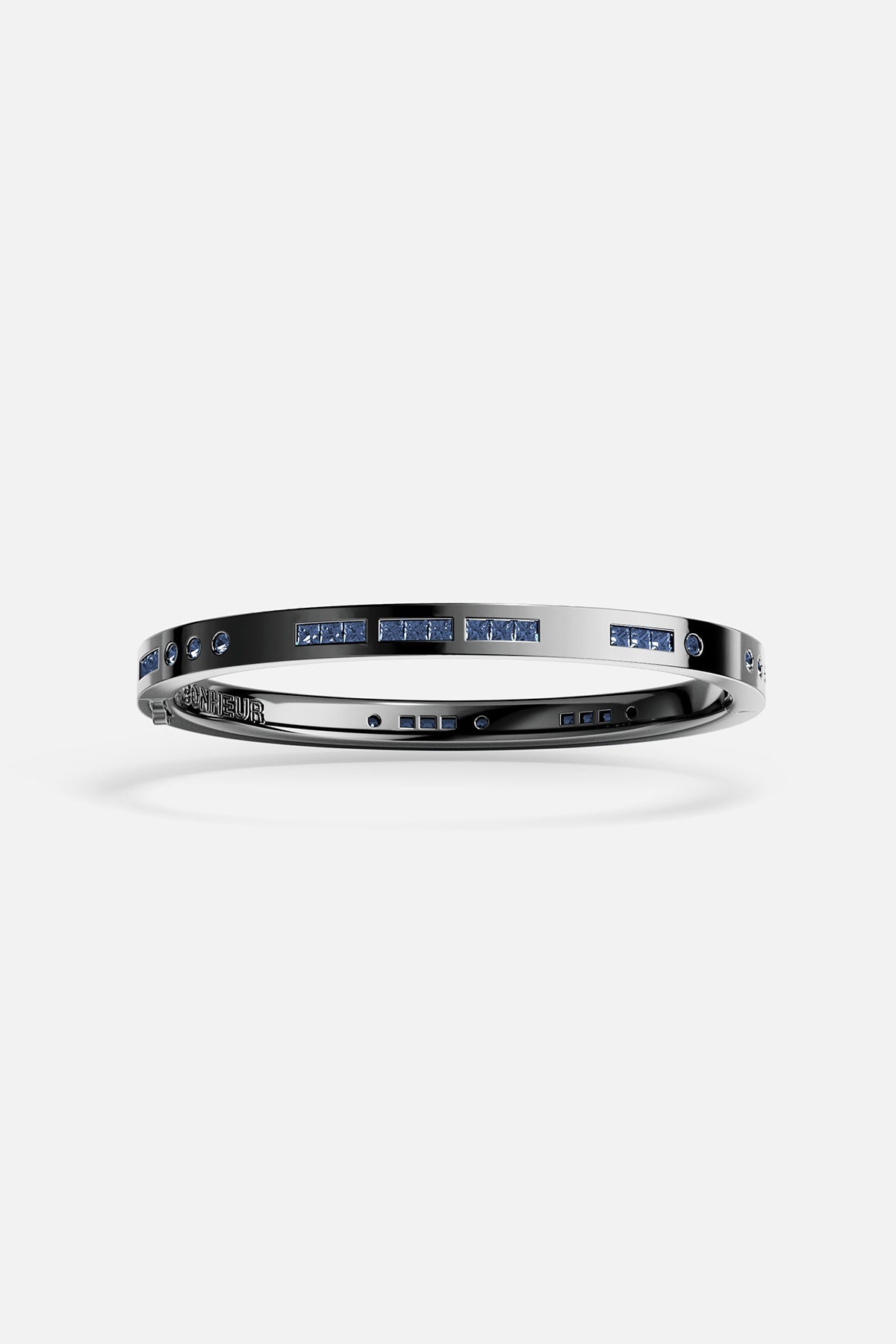 Bracelets APM Monaco gray Morse-code bangle with blue stones spelling Bonheur on a metal band.