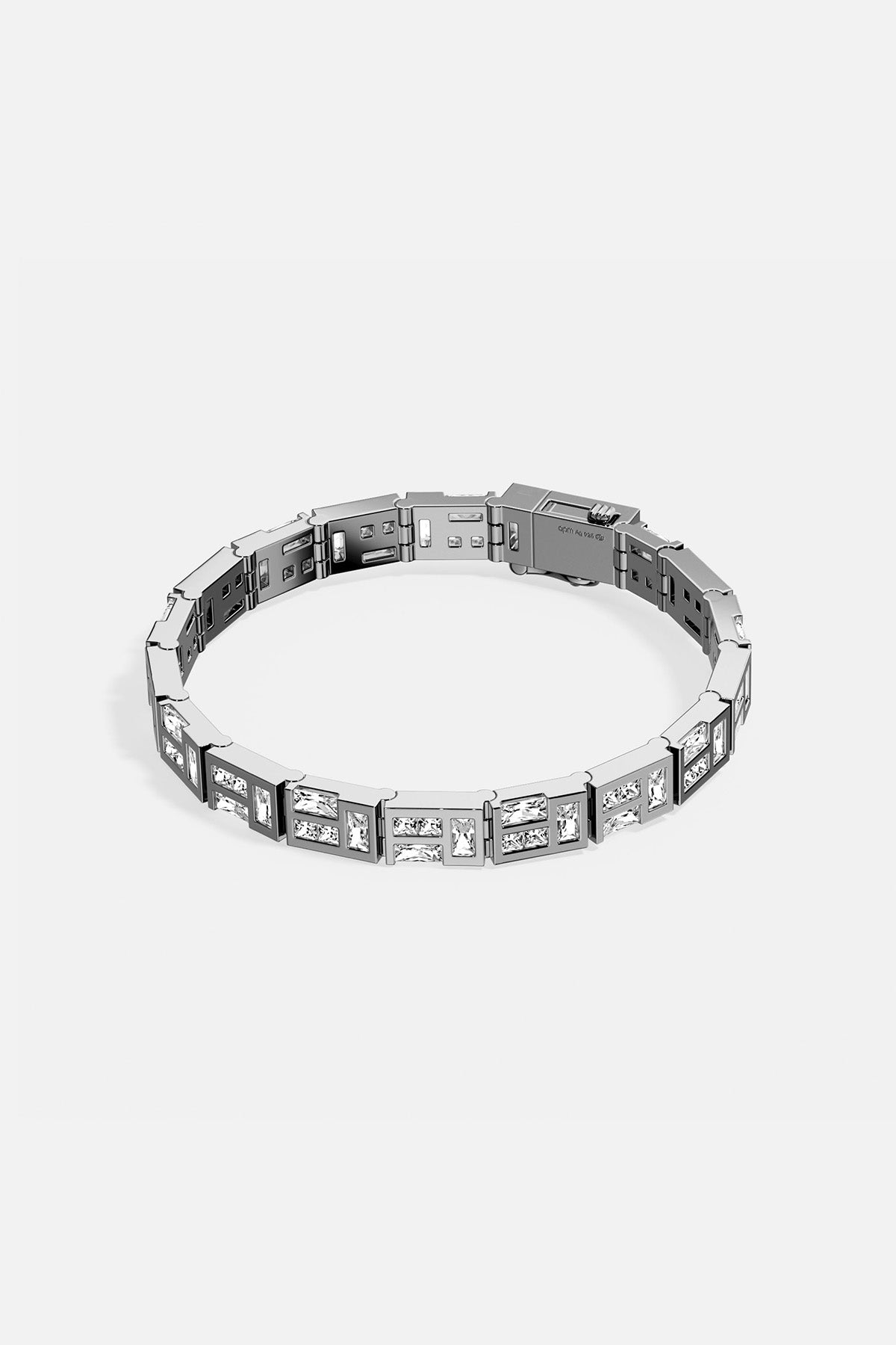 APM MONACO silver labyrinth bracelet with white stones on a white background