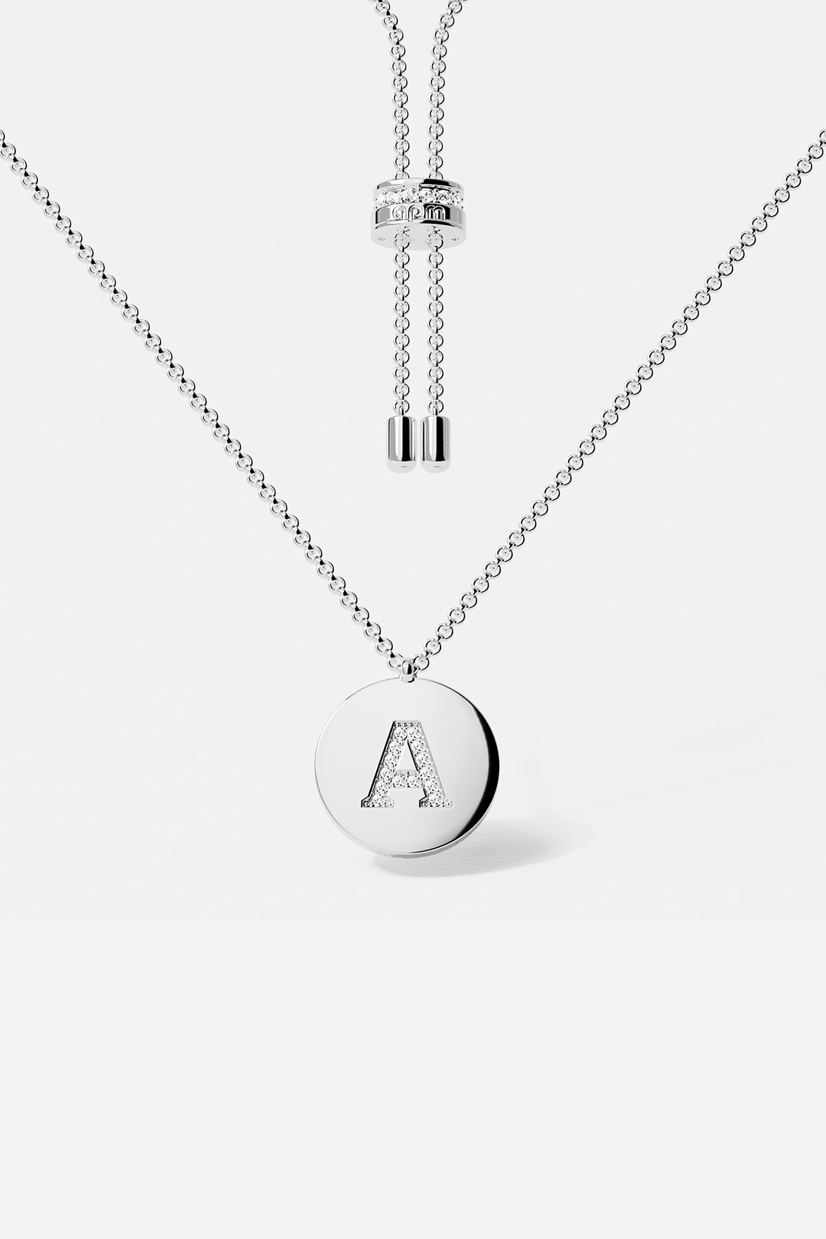 Necklaces APM Monaco adjustable silver necklace with a round pendant featuring a diamond-studded letter A.