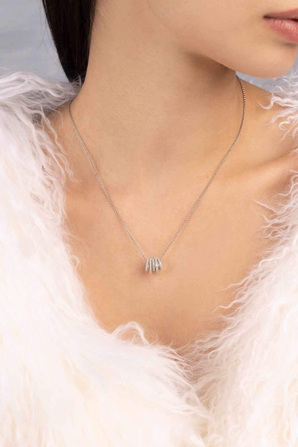 APM MONACO silver necklace with hoop adjustable design worn on model