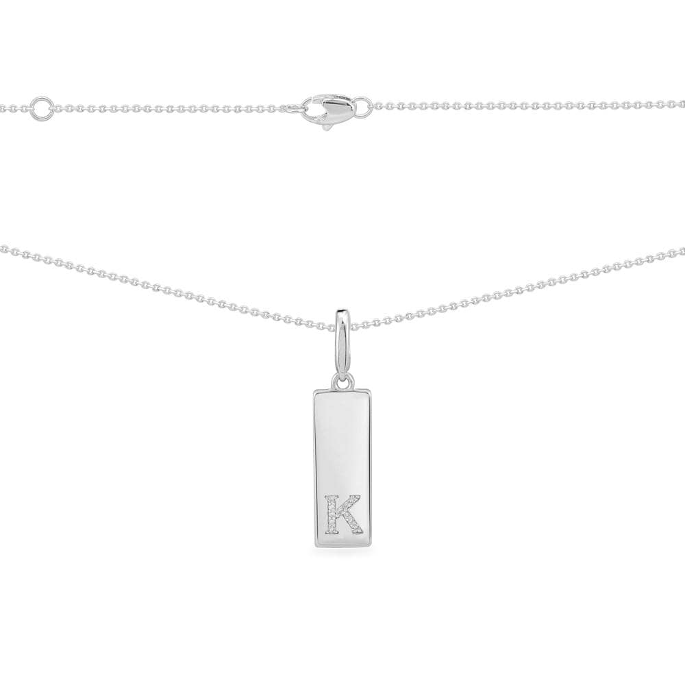 Necklaces APM Monaco: silver ball chain necklace with a vertical bar pendant encrusted with clear stones forming a K.