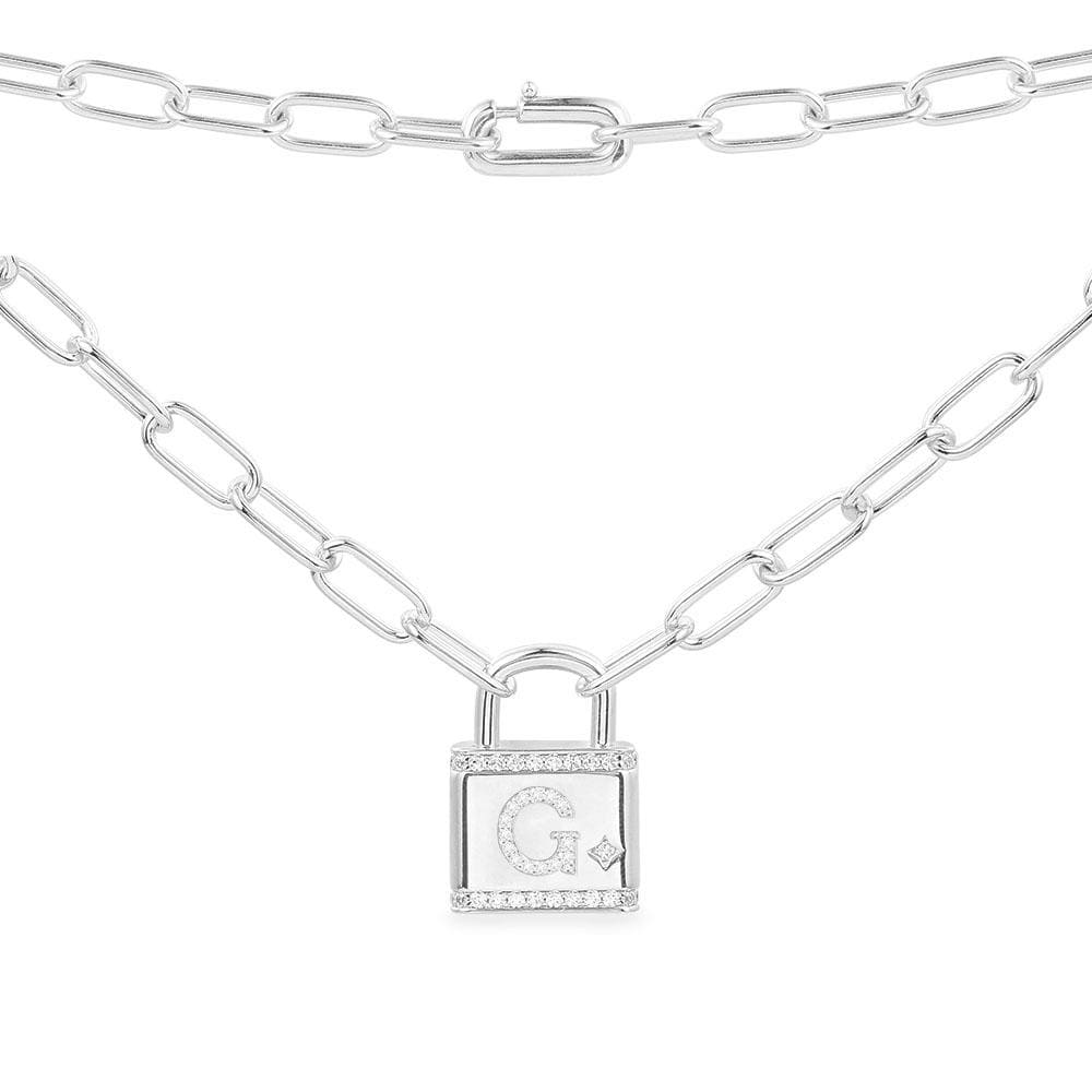 Necklaces APM Monaco: square silver-tone lock-necklace with a G initial pendant encrusted with crystals.