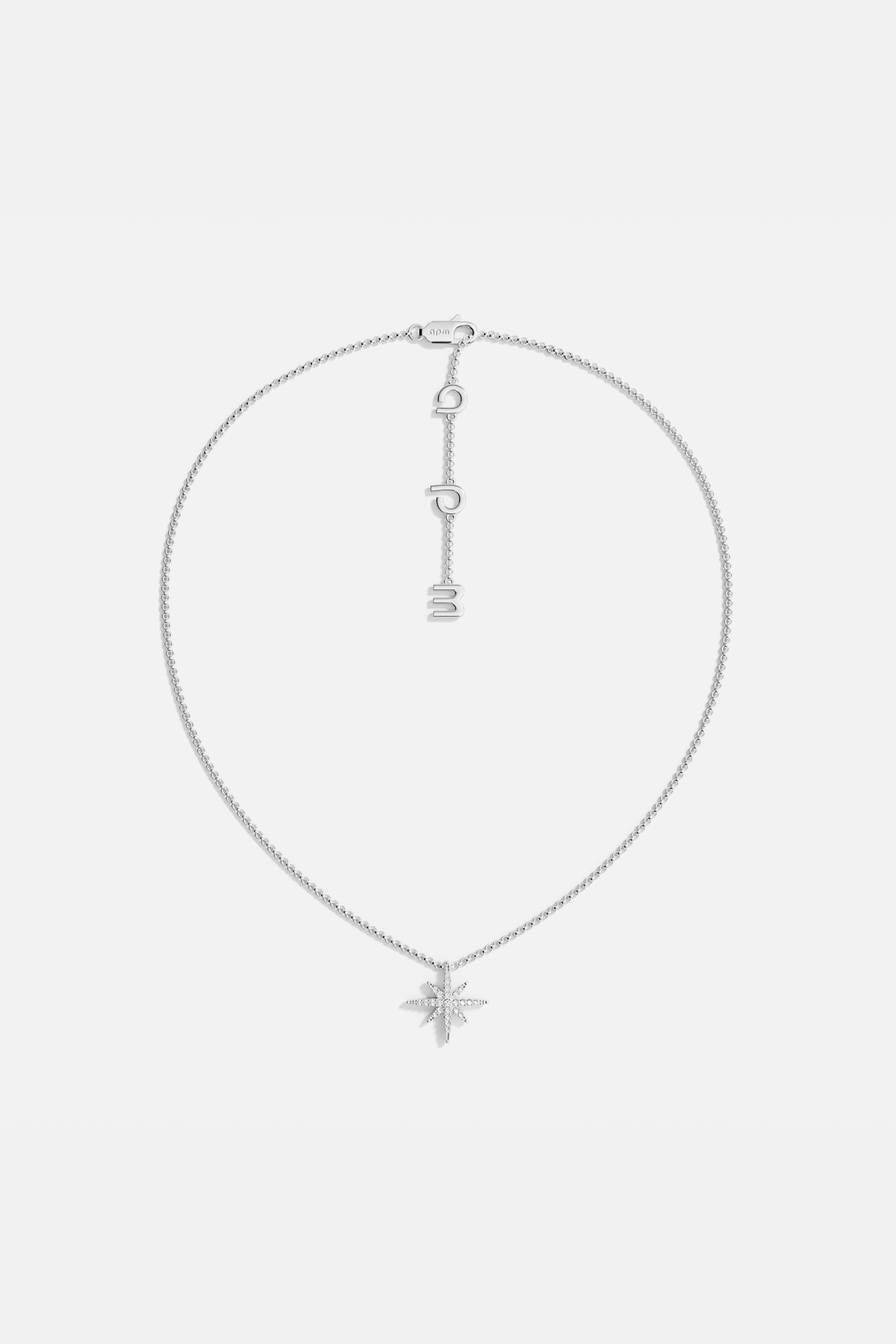 Necklaces APM Monaco, silver star-shaped pendant on a chain with meteorite texture.