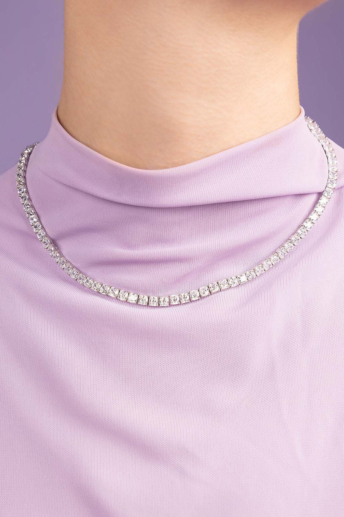 APM Monaco Pave Choker worn on model with lilac background