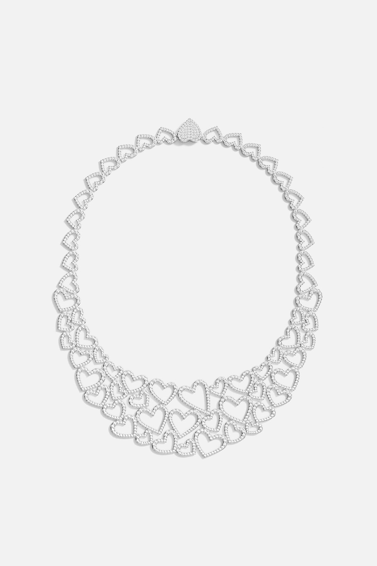 APM MONACO silver necklace with heart-shaped pendants on a white background