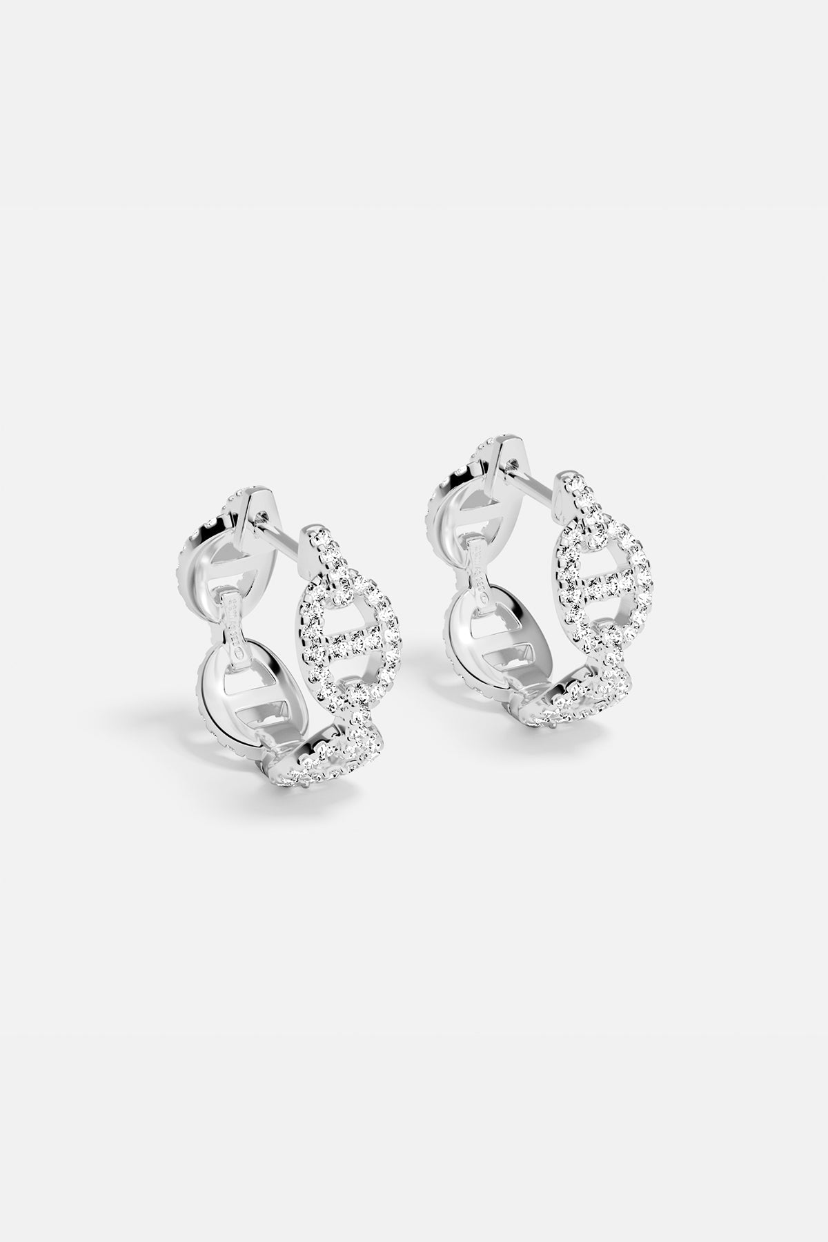 Earrings APM Monaco, silver-tone hoop earrings encrusted with white cubic zirconia.