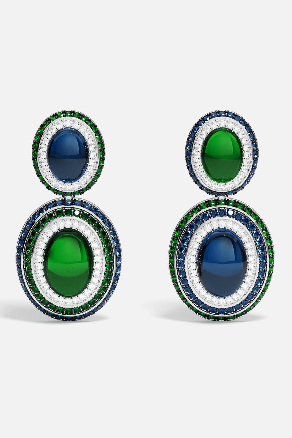 Pair of earrings with green and blue stones on a white background