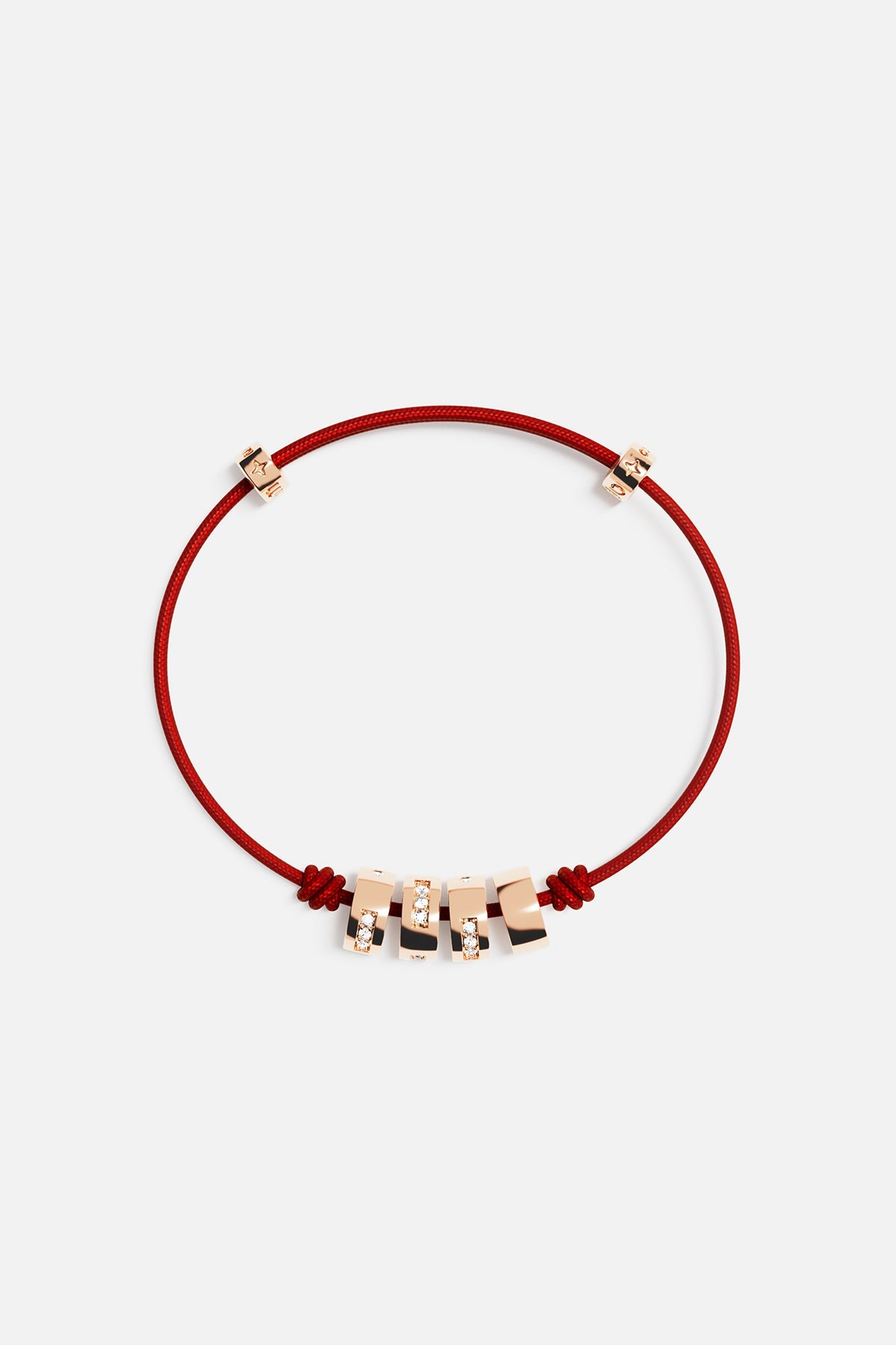 Bracelets APM Monaco red thread morse-code string bracelet with gold-tone charms.