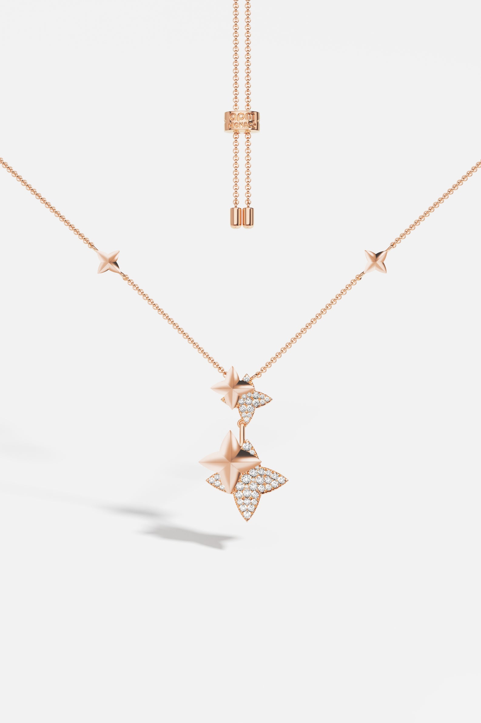 Necklaces APM Monaco, rose gold adjustable necklace with star-shaped pendants, some with inset diamonds.