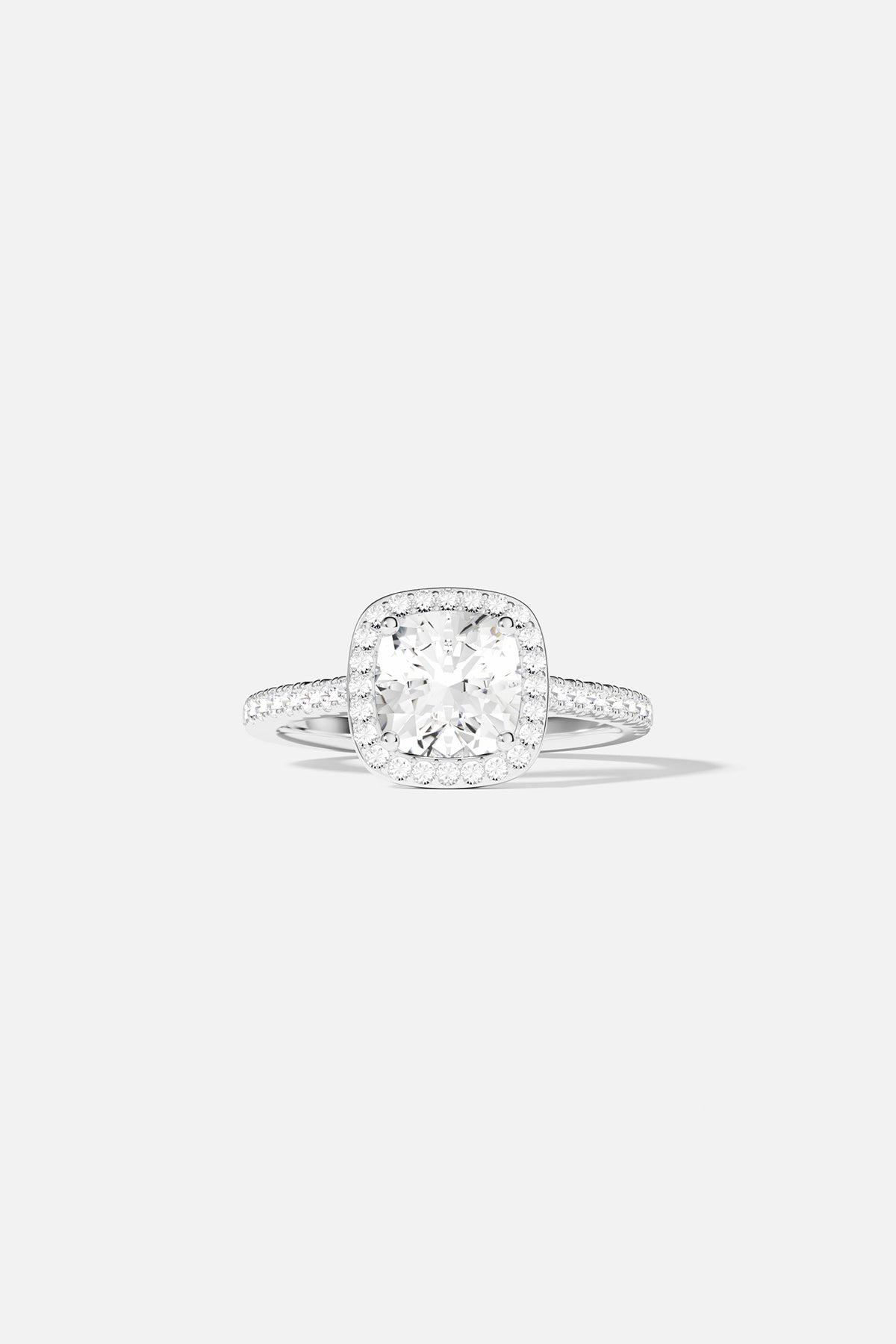 ziconia ring with a cushion-cut gemstone on a light gray background