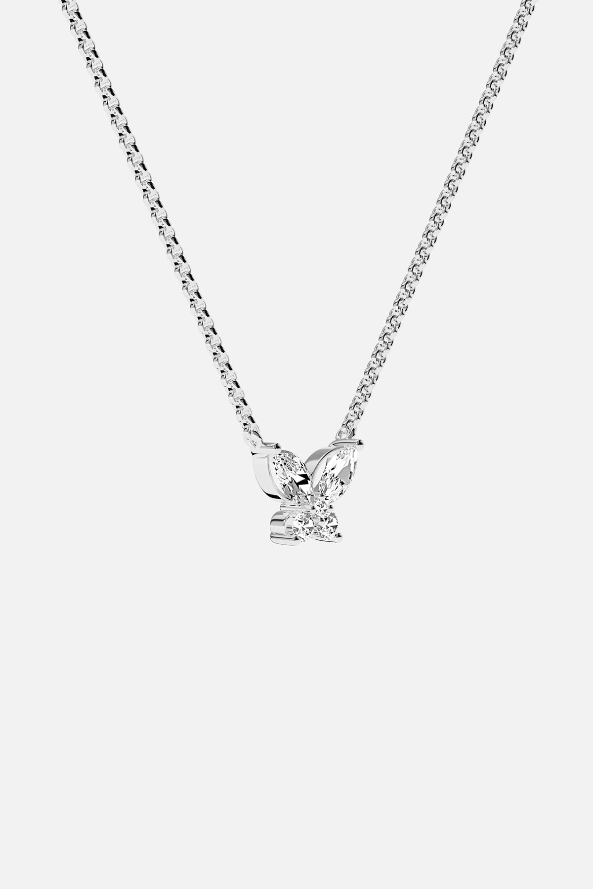 Necklaces APM Monaco. White gold butterfly necklace with white cubic zirconia on a Silver-tone chain; butterfly pendant and APM clasp.