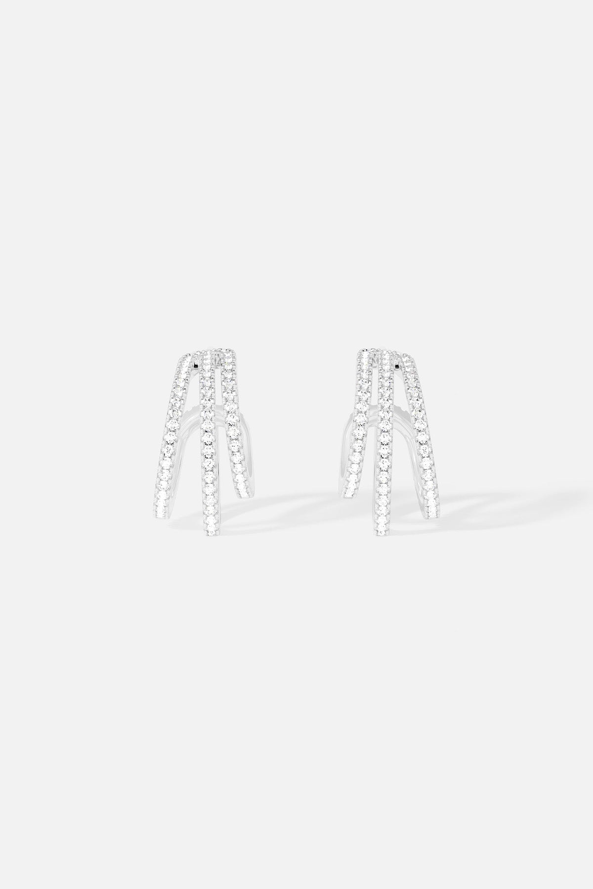 Earrings APM Monaco triple hoop design in white metal with pavé cubic zirconia .