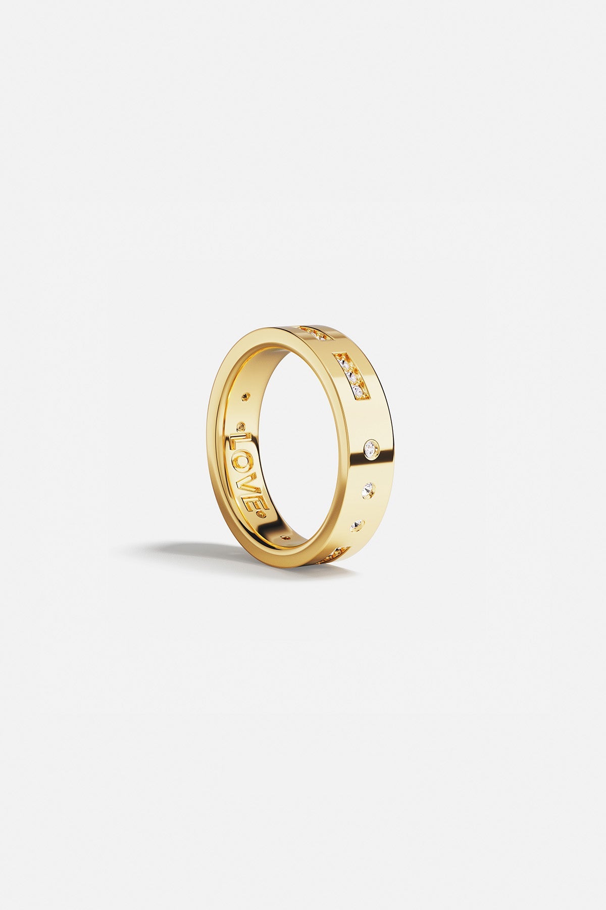 Rings APM Monaco. Yellow gold ring with diamonds on the outside and 'LOVE' engraved on the inside.