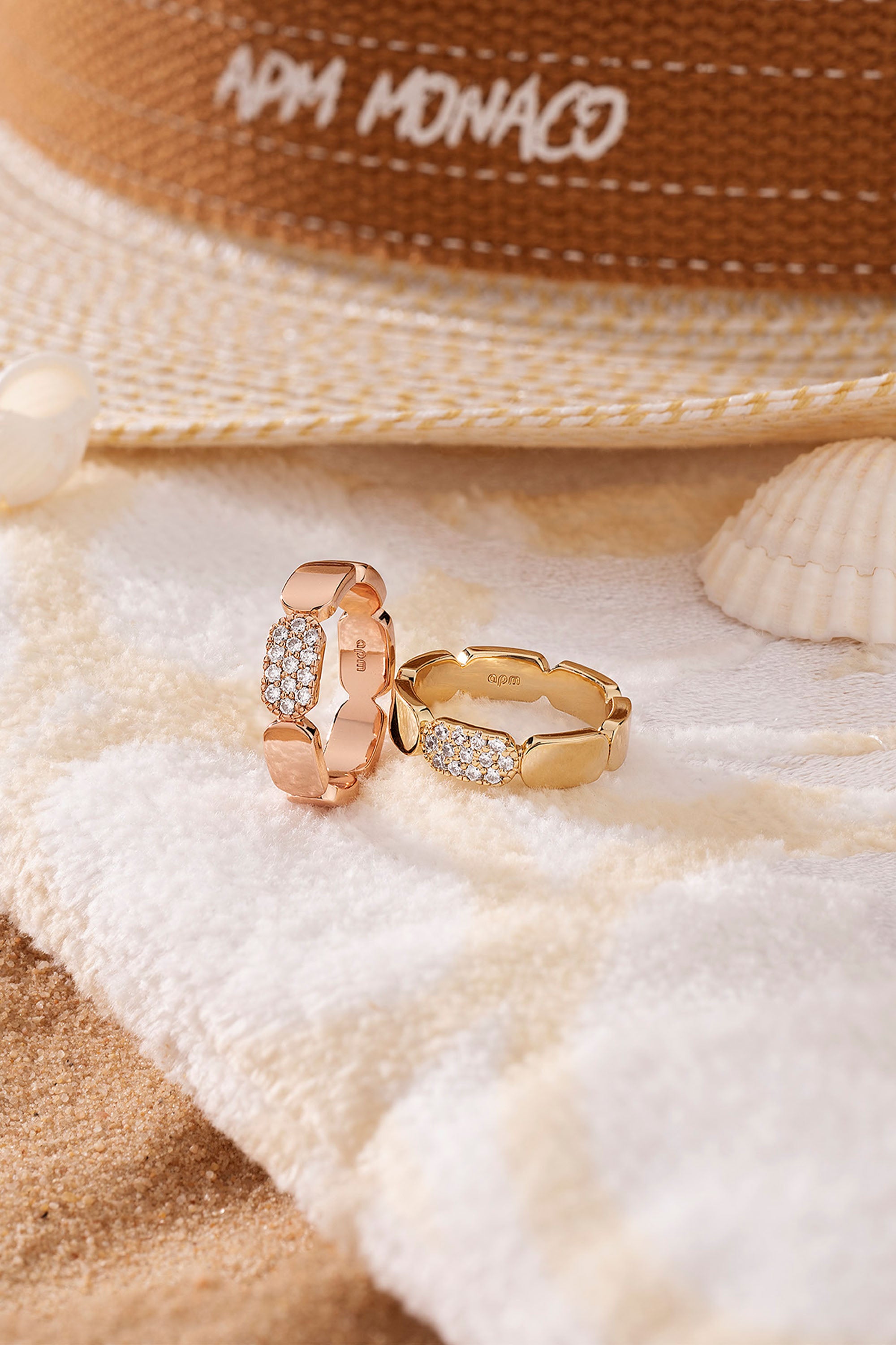 APM Monaco Dainty Gold Ring on soft blanket