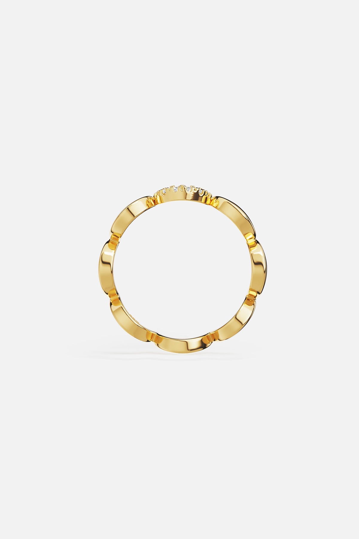 Rings APM Monaco yellow gold wavy pave ring with a row of diamonds along one side.