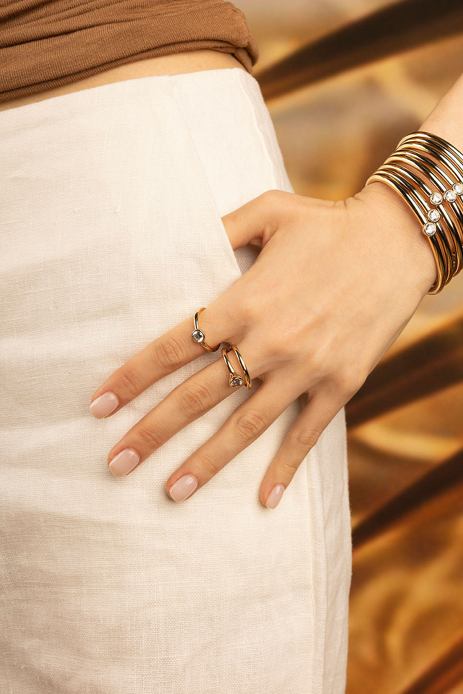 APM Monaco Twist Éclat Ring in Yellow Gold worn on hand