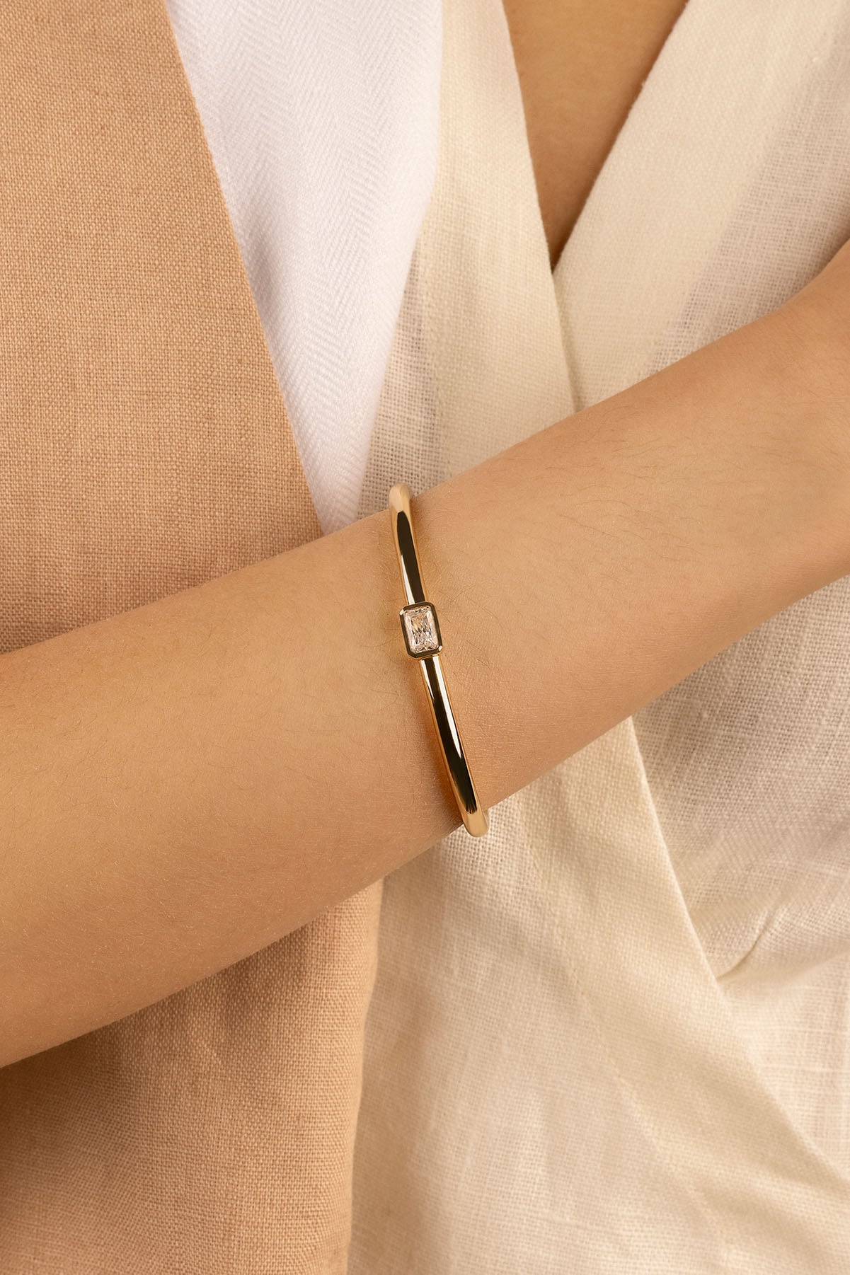 APM Monaco Éclat Cuff in Yellow Gold worn on hand