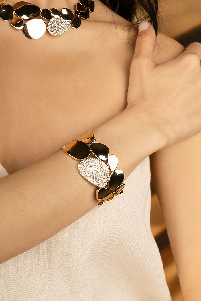 APM Monaco Statement Galet Bangle in yellow gold