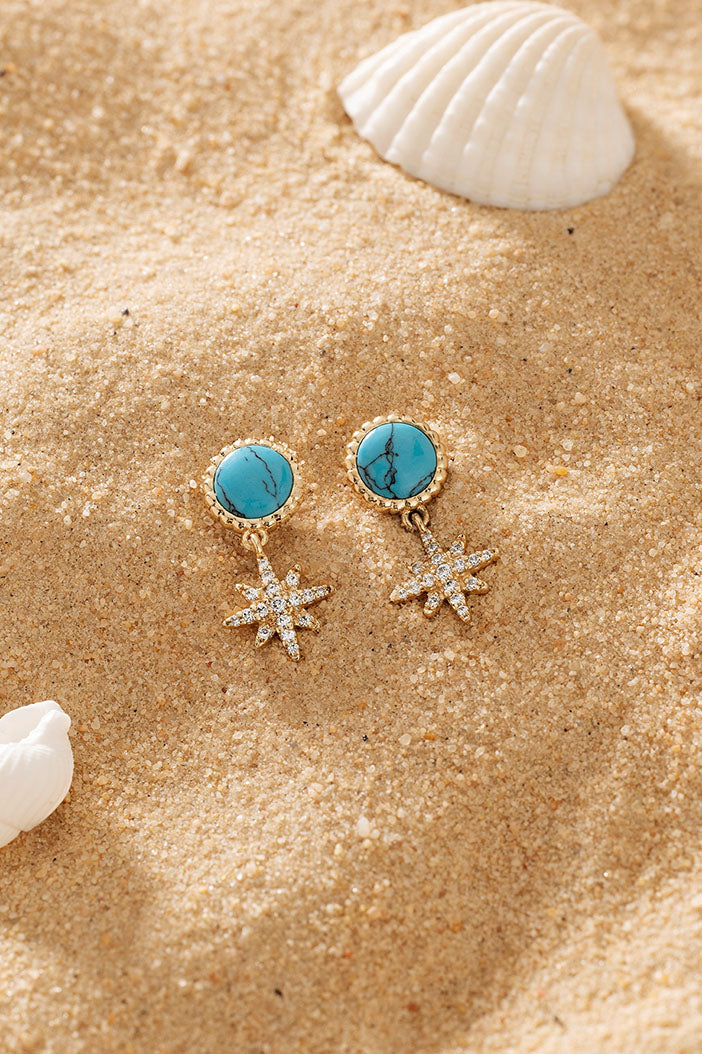 APM Monaco Lagoon Météorites Earrings in Yellow Gold on soft beach
