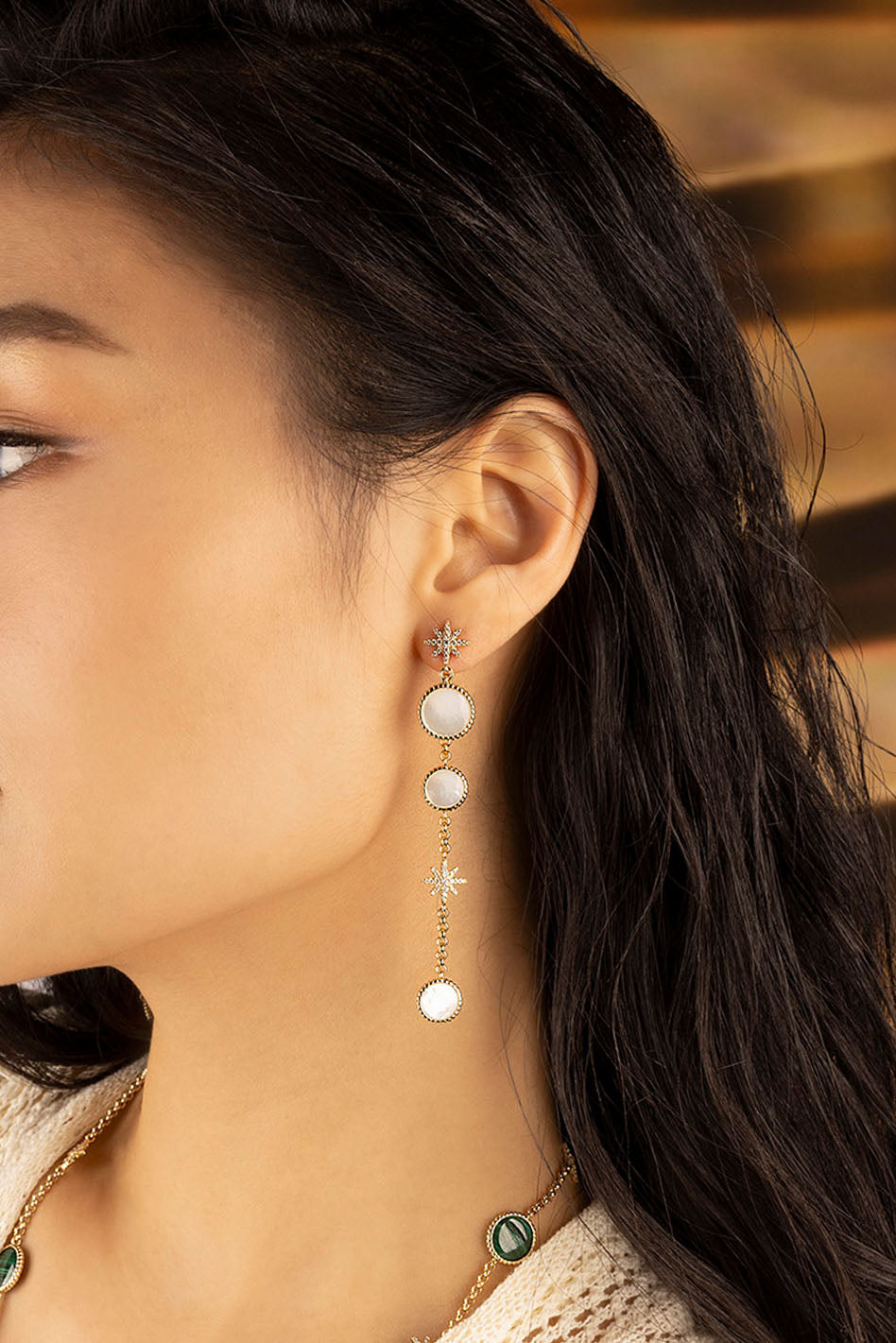 APM Monaco White Nacre Météorites Ear Jackets in Yellow Gold worn on ear