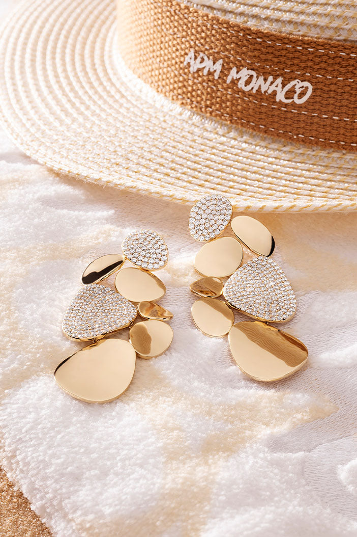 APM Monaco Statement Galet Earrings in Yellow Gold on soft blanket