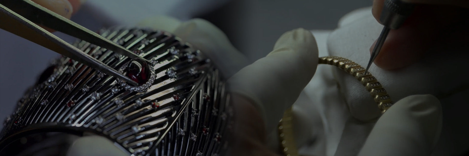Close-up of hands working on a piece of APM MONACO jewelry with intricate designs.