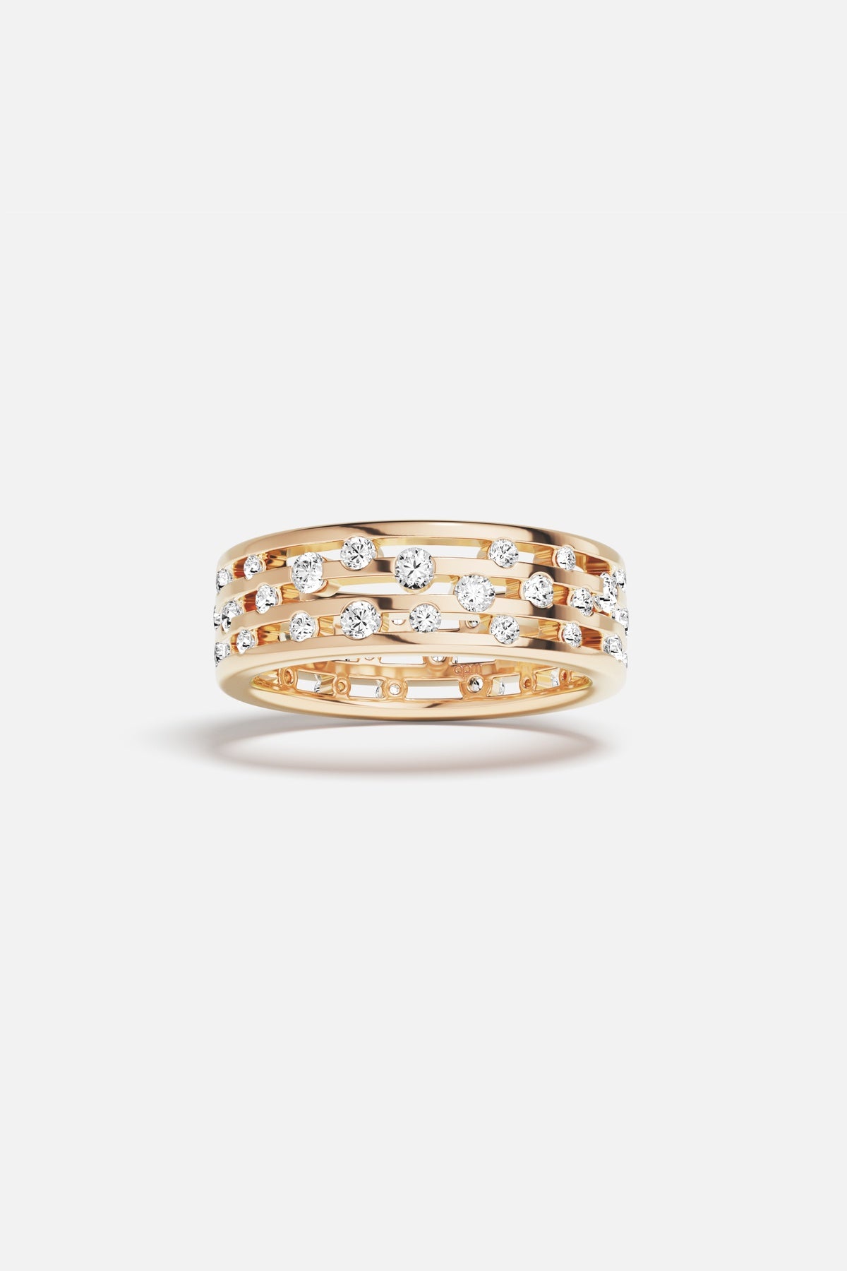 APM Ring in warm gold color, scattered stones dancing with quiet radiance.