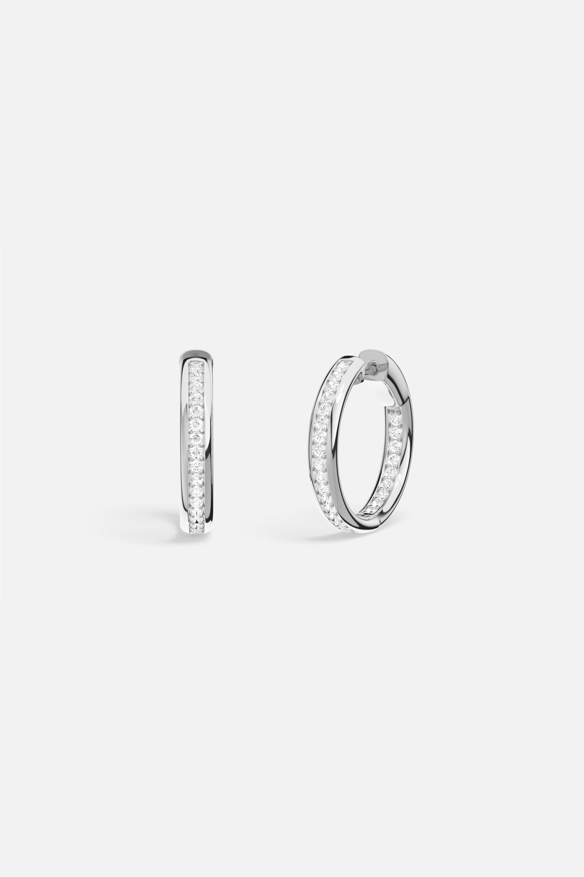 APM Hoop Earrings, a luminous rhodium finish circle for effortless everyday radiance.