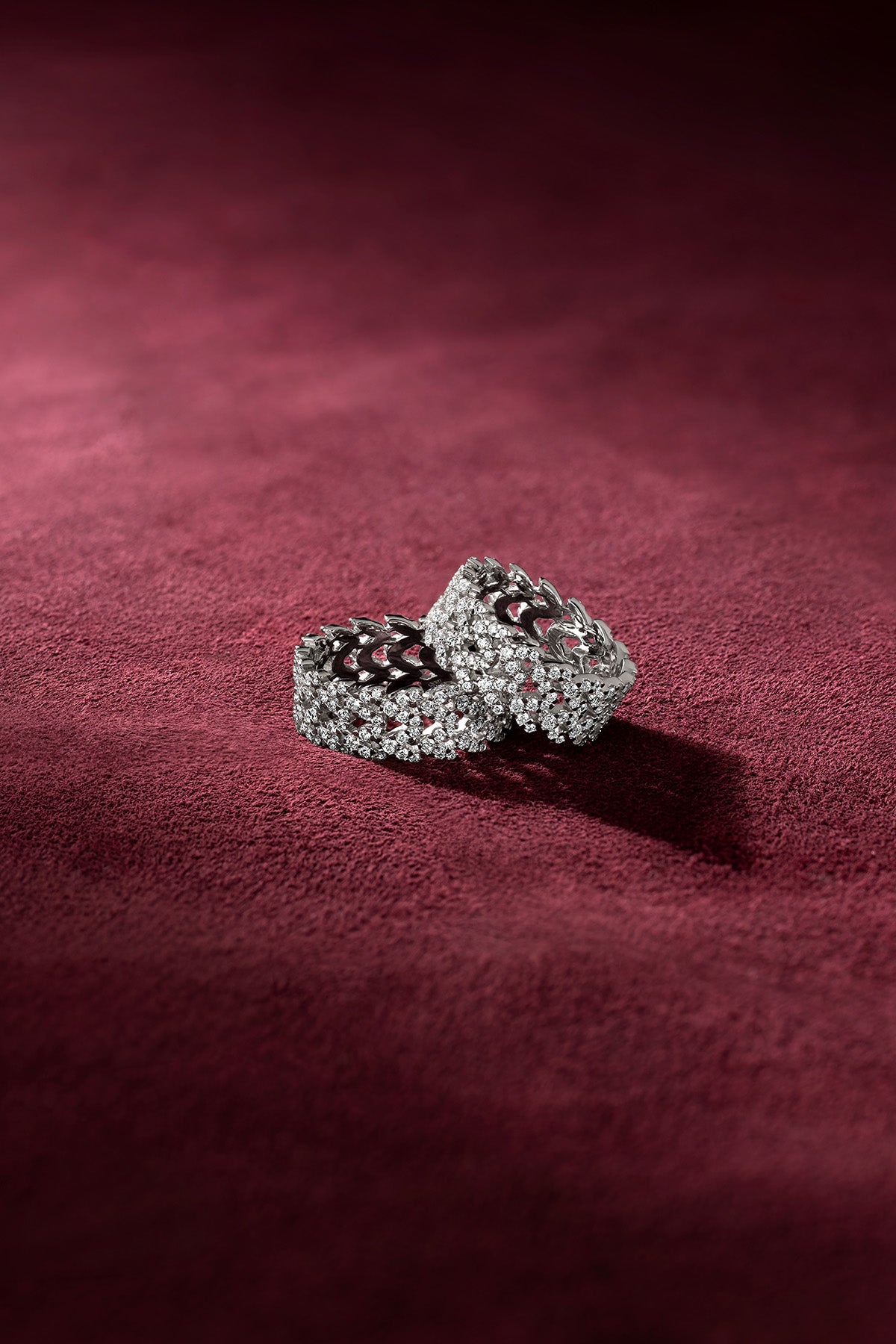 APM Monaco Rings shimmering on velvet, a whisper of bold elegance.