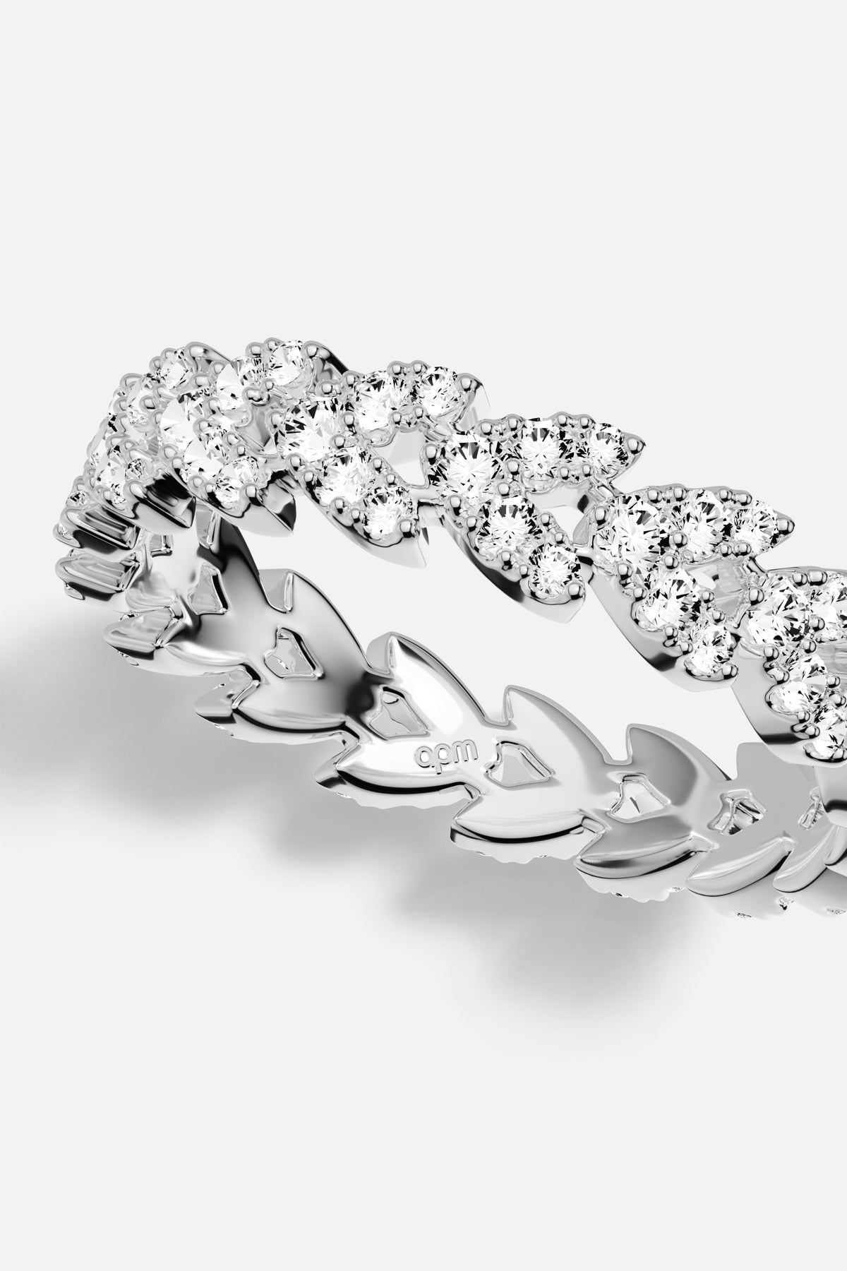 APM Ring in rhodium finish, a shimmering laurel whispering timeless elegance.