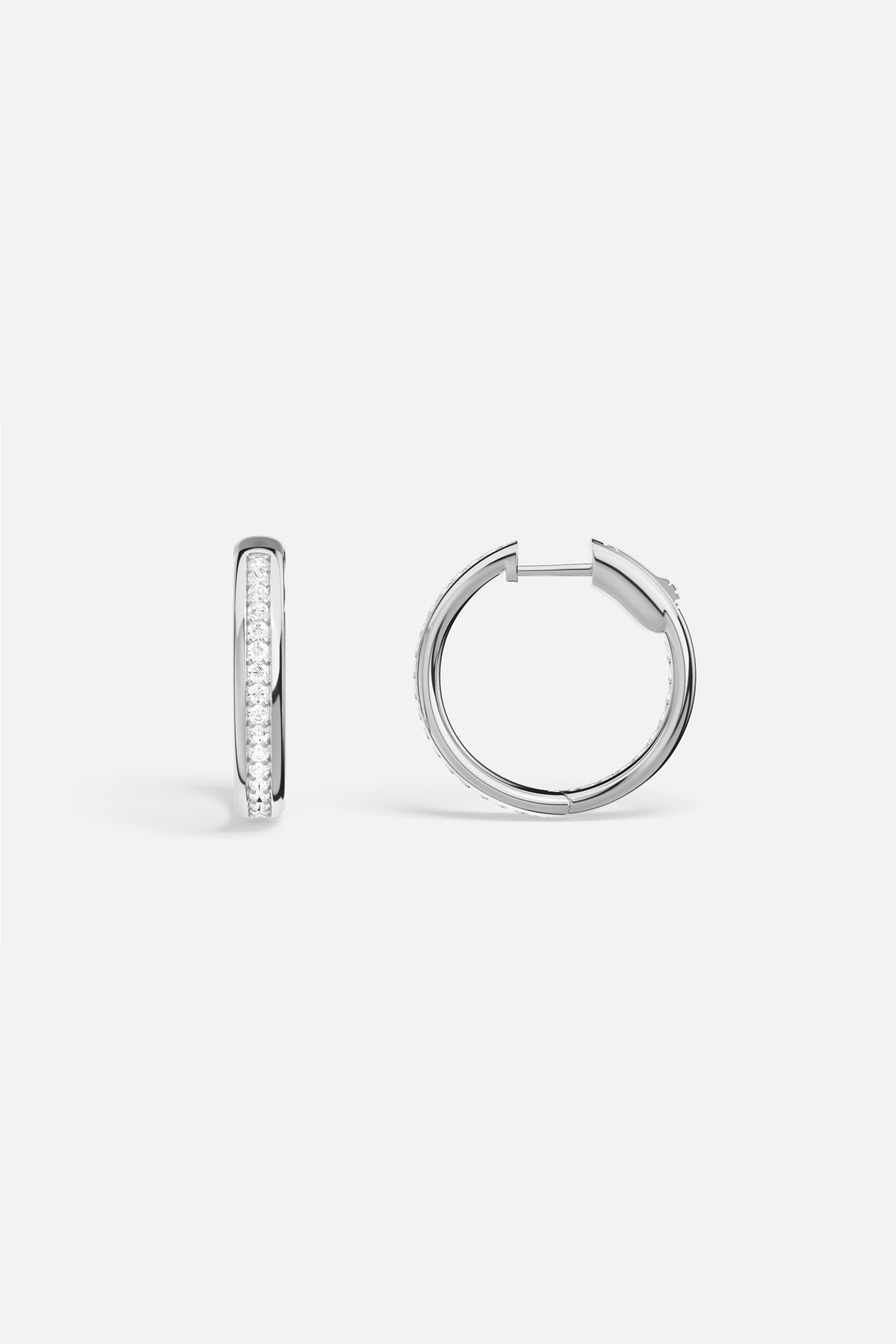 APM Hoop Earrings in rhodium finish, a luminous circle of effortless elegance.