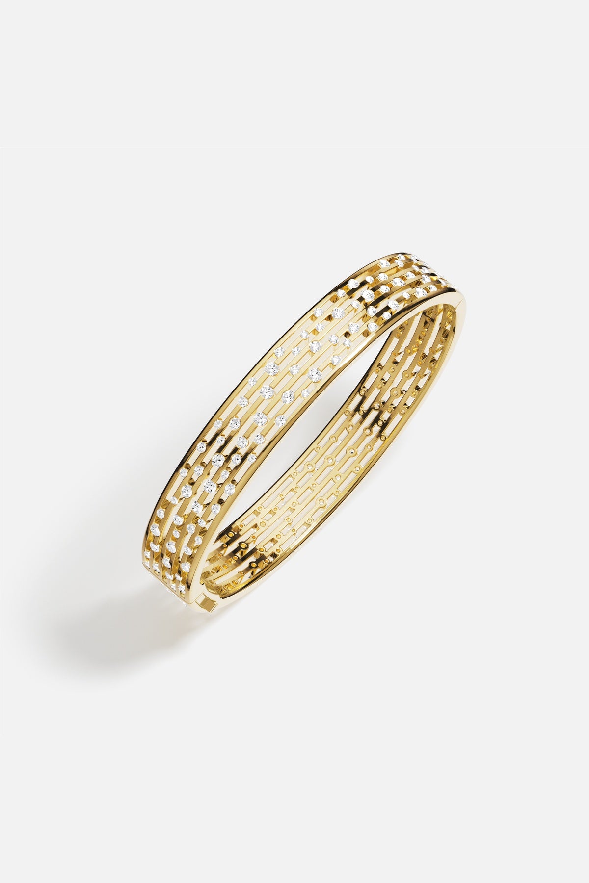 APM Bangle in golden hues, scattered sparkles dancing with quiet radiance.