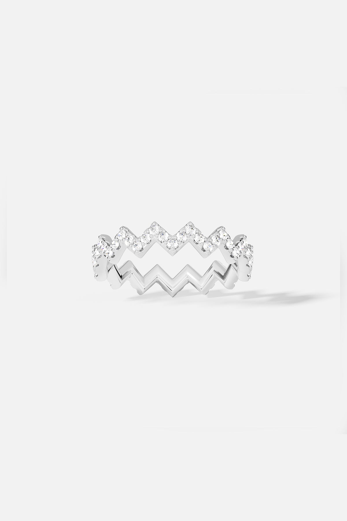 Rings APM Monaco, white pavé zig-zag ring with small rhinestones.
