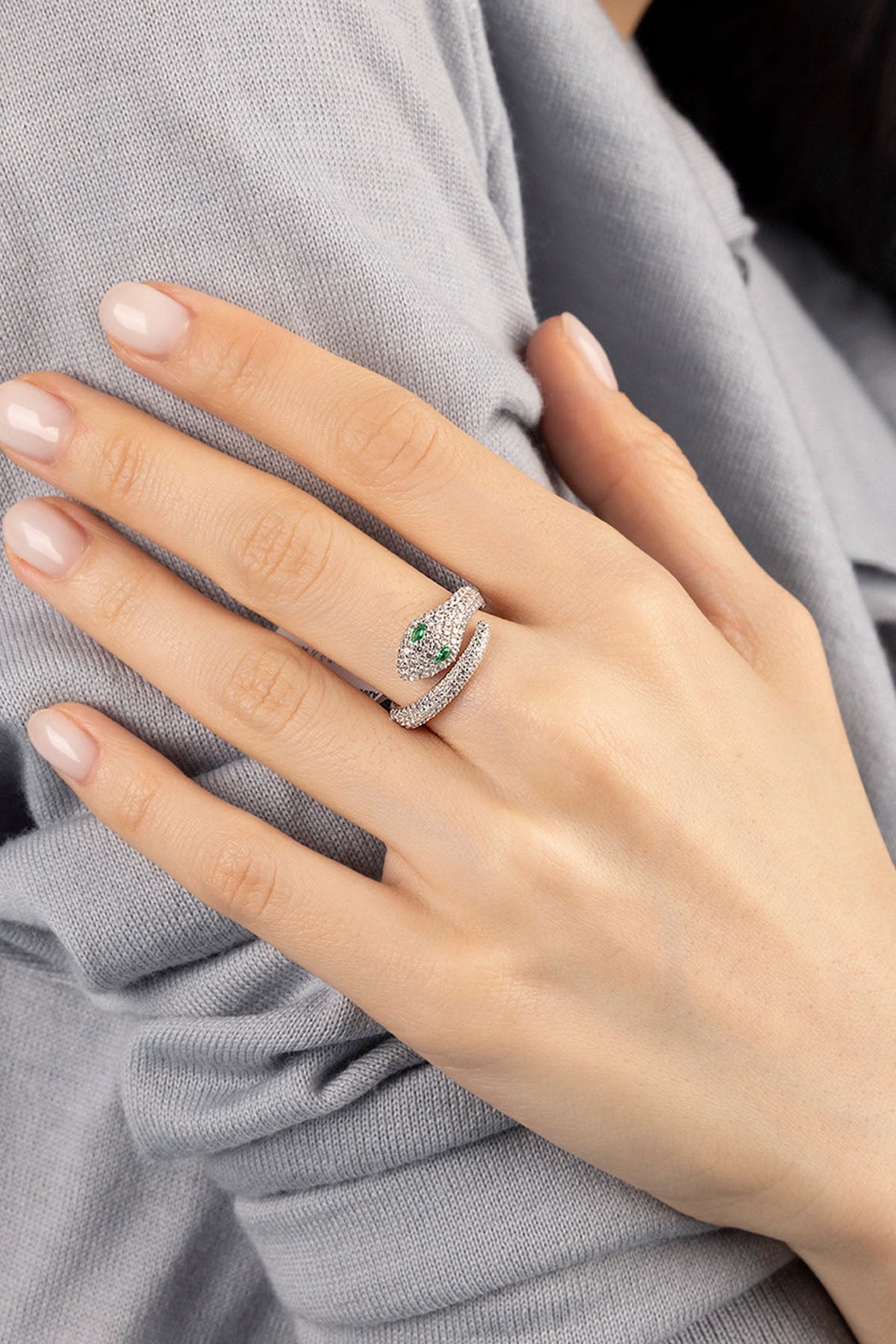  APM Monaco Kaa Wrap Ring in silver worn on hand