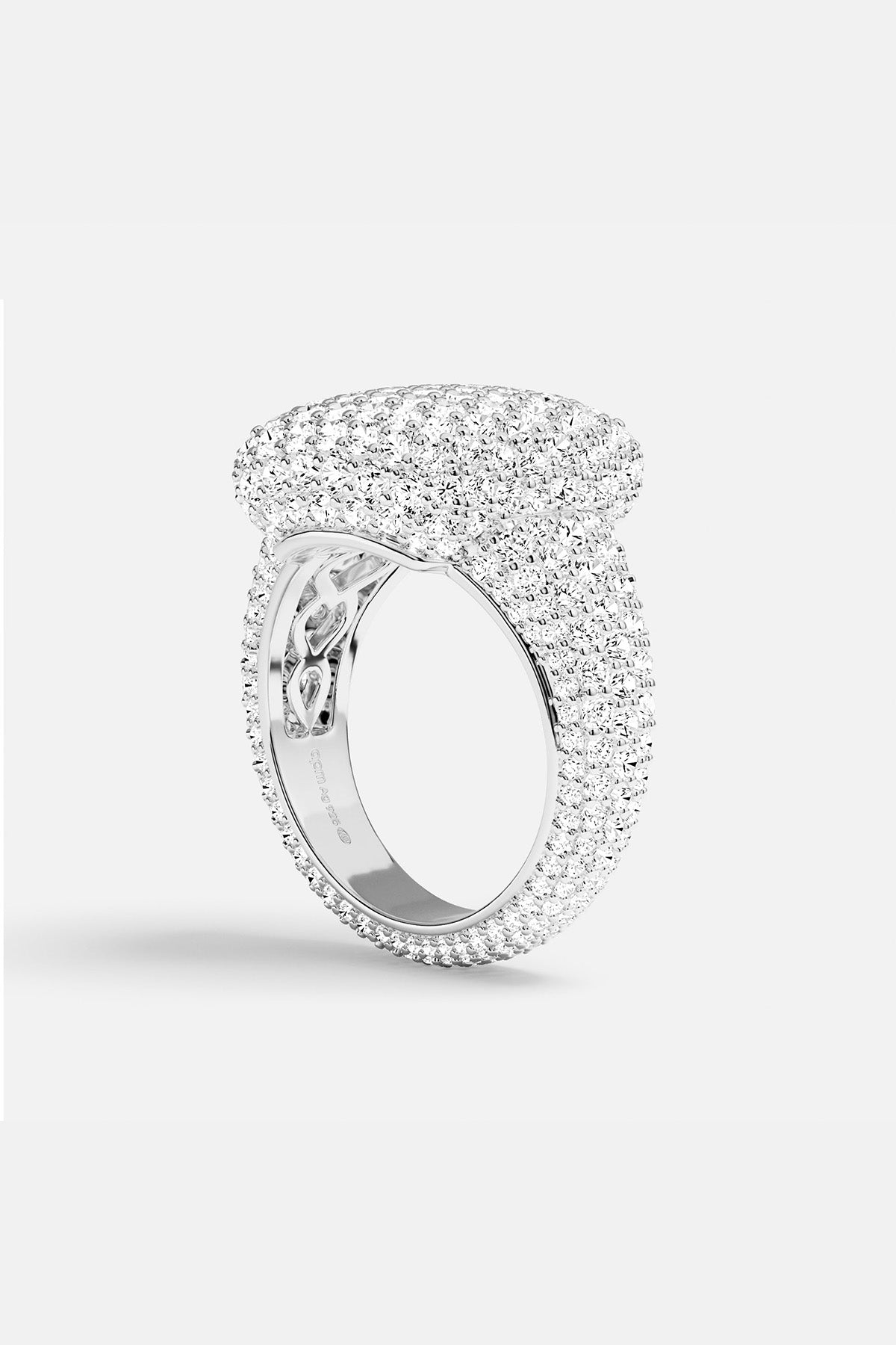 APM MONACO silver ring with embedded white stones on a light background