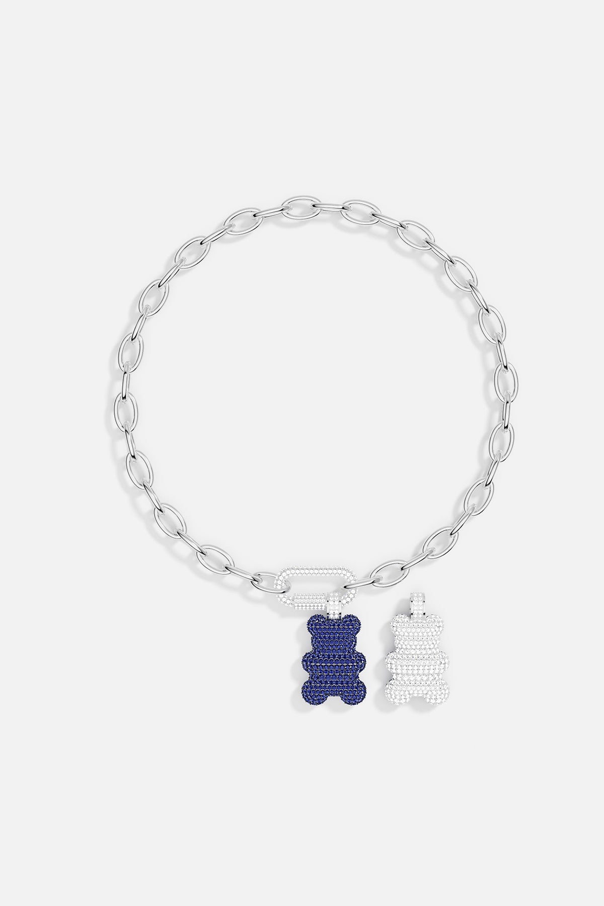 Necklaces APM Monaco: silver chain with white crystal-accented clasp and two gummy bear charms in white and blue crystals.