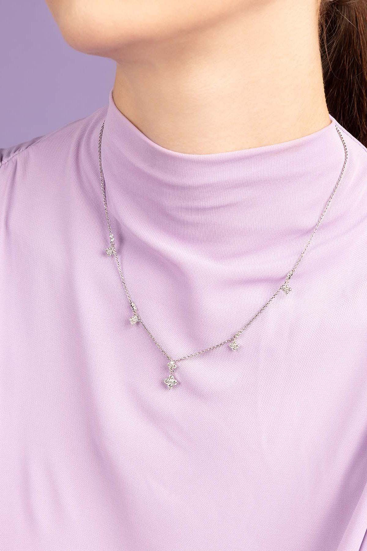 APM Monaco Spark Adjustable Necklace worn on model with lilac background