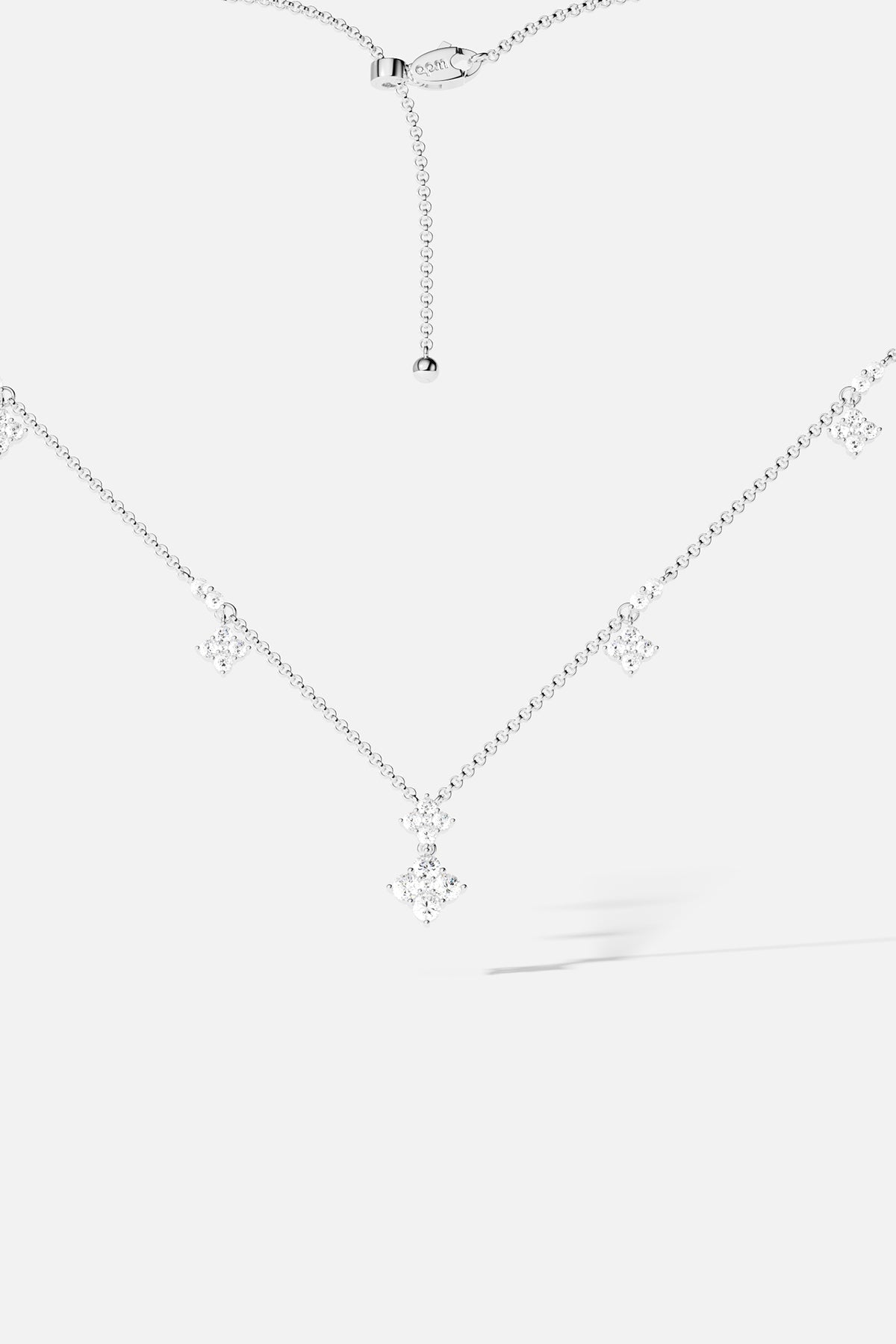 Necklaces APM Monaco adjustable spark necklace with a silver chain and diamond pendant.