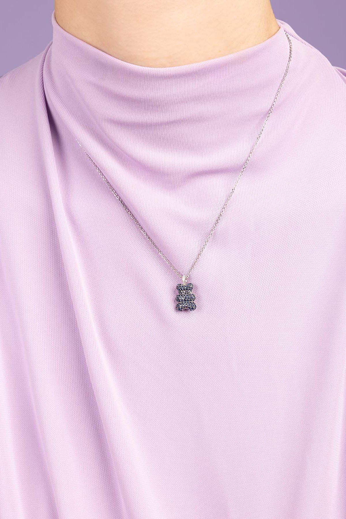 APM Monaco Baby Baba Yummy Bear Adjustable Necklace worn on model with lilac background