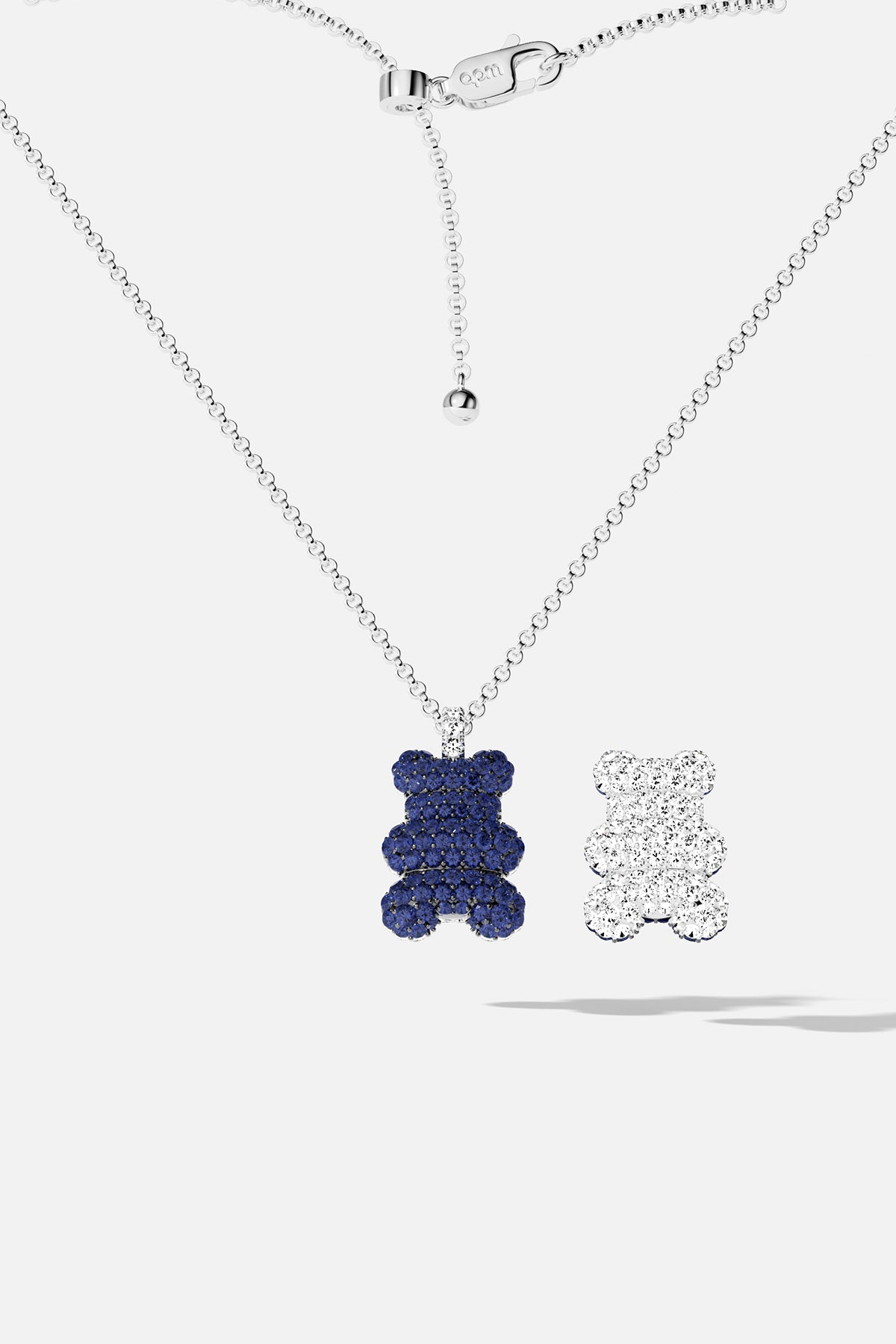 Blue teddy bear pavé pendant necklace with white teddy bear pavé pendant against a white background