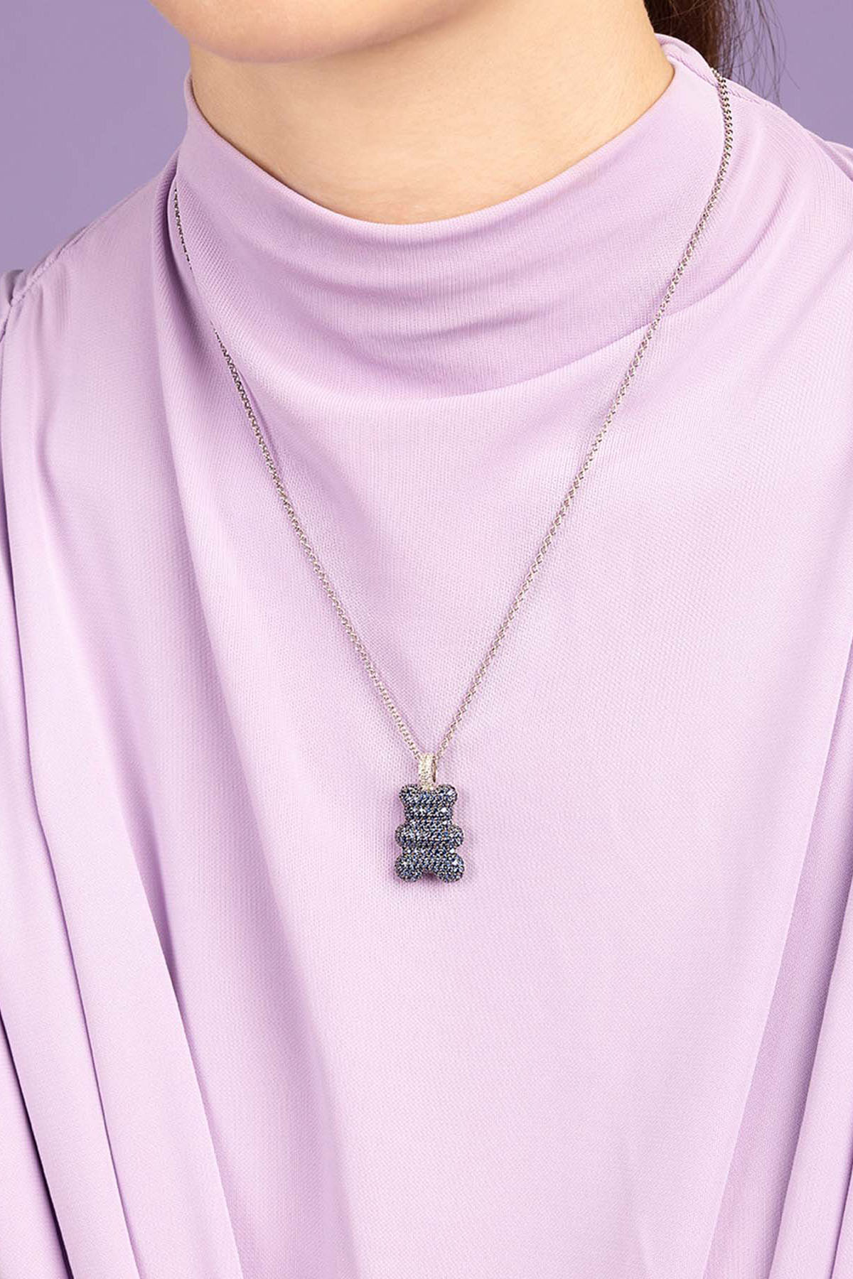 APM Monaco Baba Yummy Bear Adjustable Necklace worn on model with lilac background